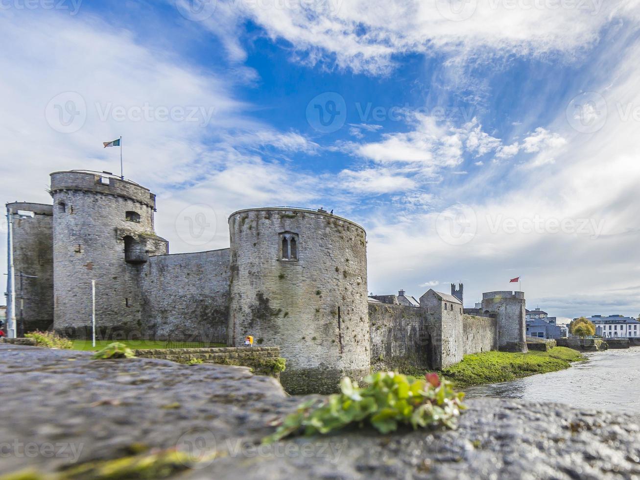 Historic city wall of Limerick with defense towers during daytime photo