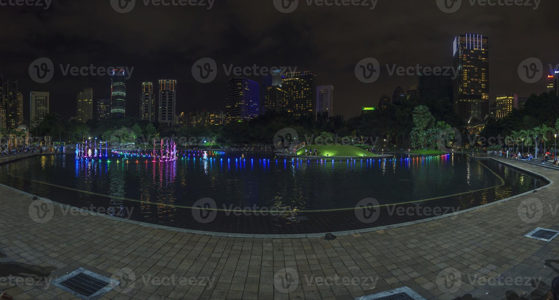 Colourfully illuminated fountain in KLCC Park in Kuala Lumpur photo