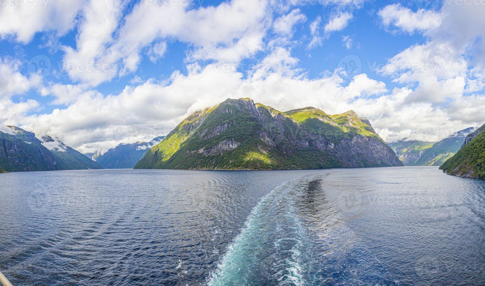 Impression from cruise ship on the way through Geiranger fjord in Norway at sunrise in summer photo