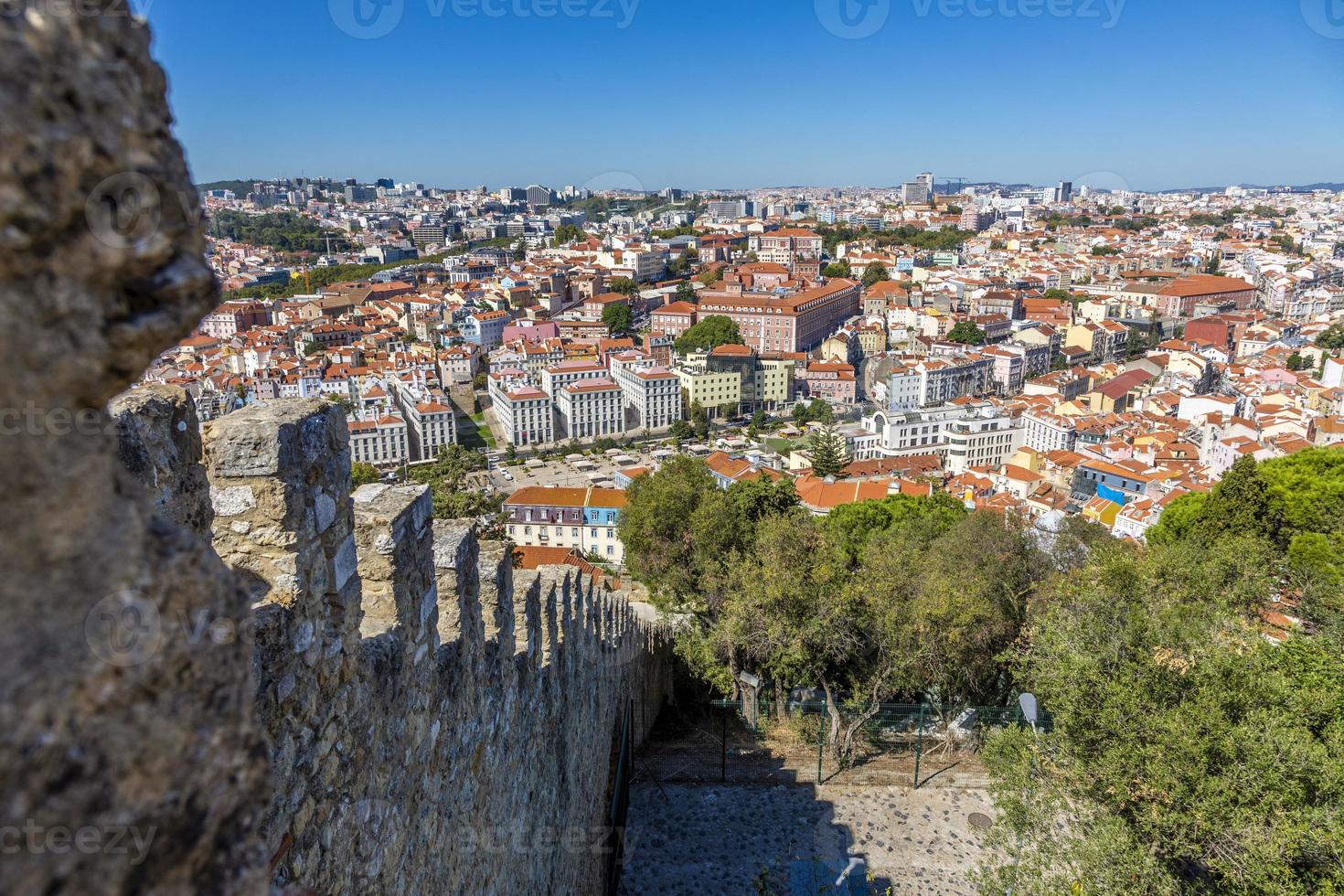 View from Castelo de Sao Jorge over Lisbon with stone wall in summer photo