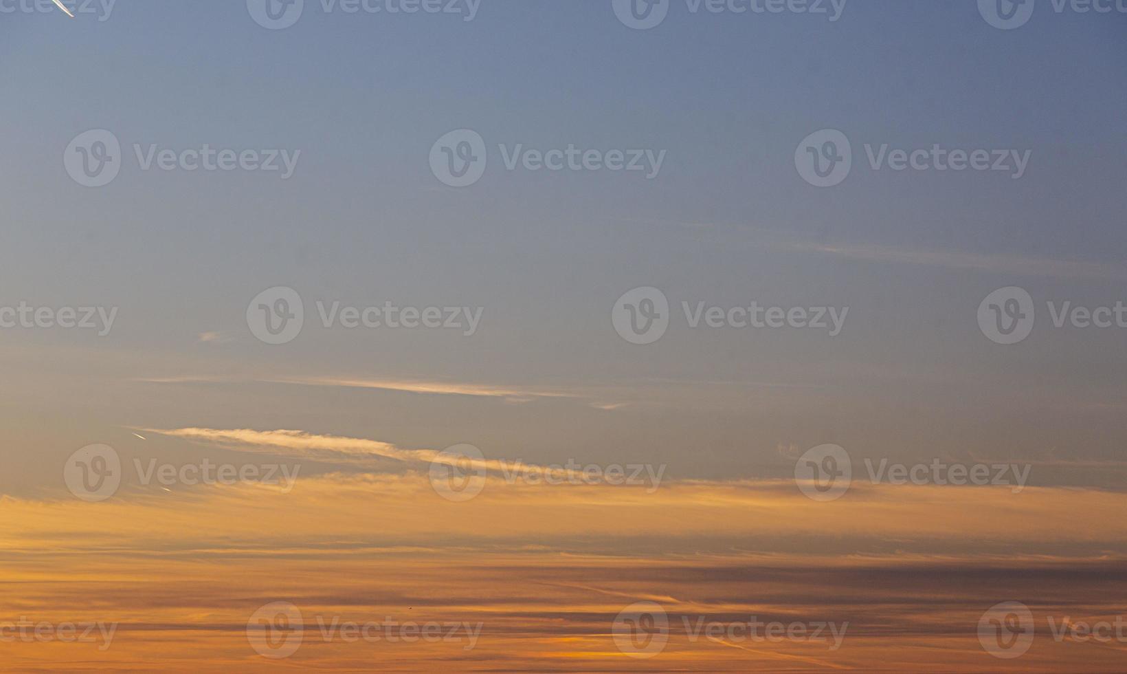 Dramatic colorful sky with afterglow and illuminated clouds photo