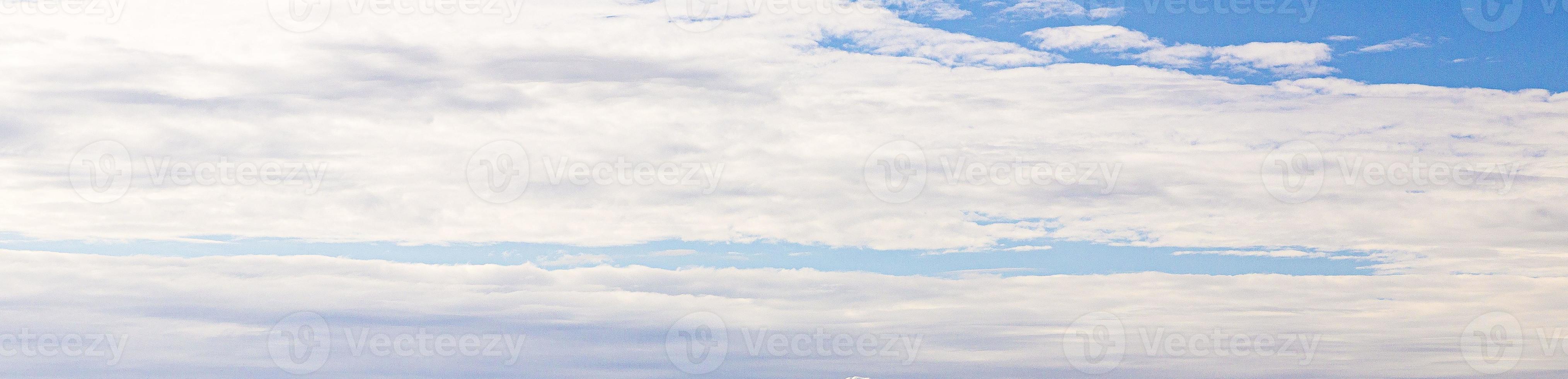 Image of a partly cloudy and partly clear sky during the day photo