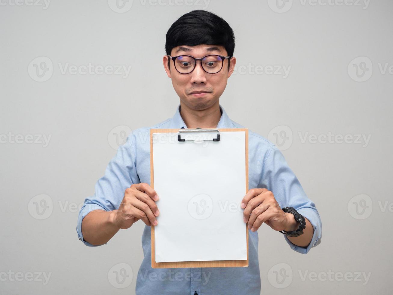 Positive asian man wear glasses smile and showing blank document board in hand isolated photo