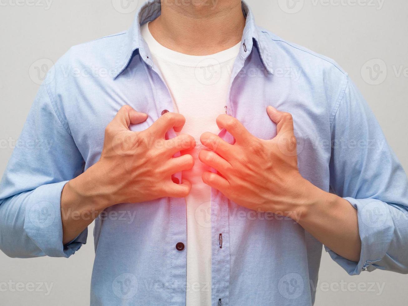 Close up man pain heart hand hold his chest isolated photo