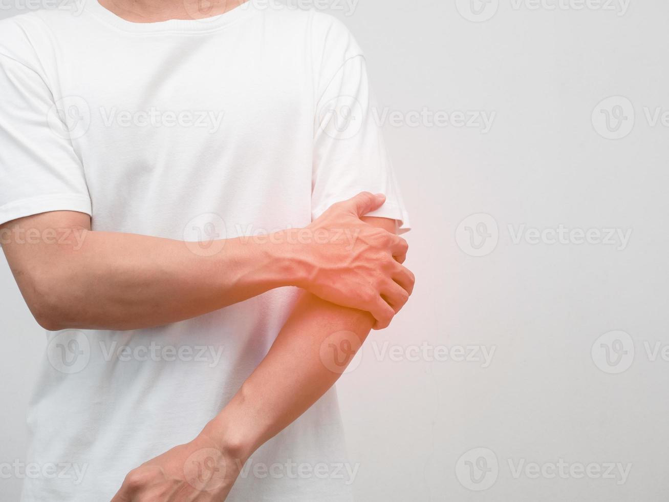 Male employee elbow pain from hard working office syndrome photo