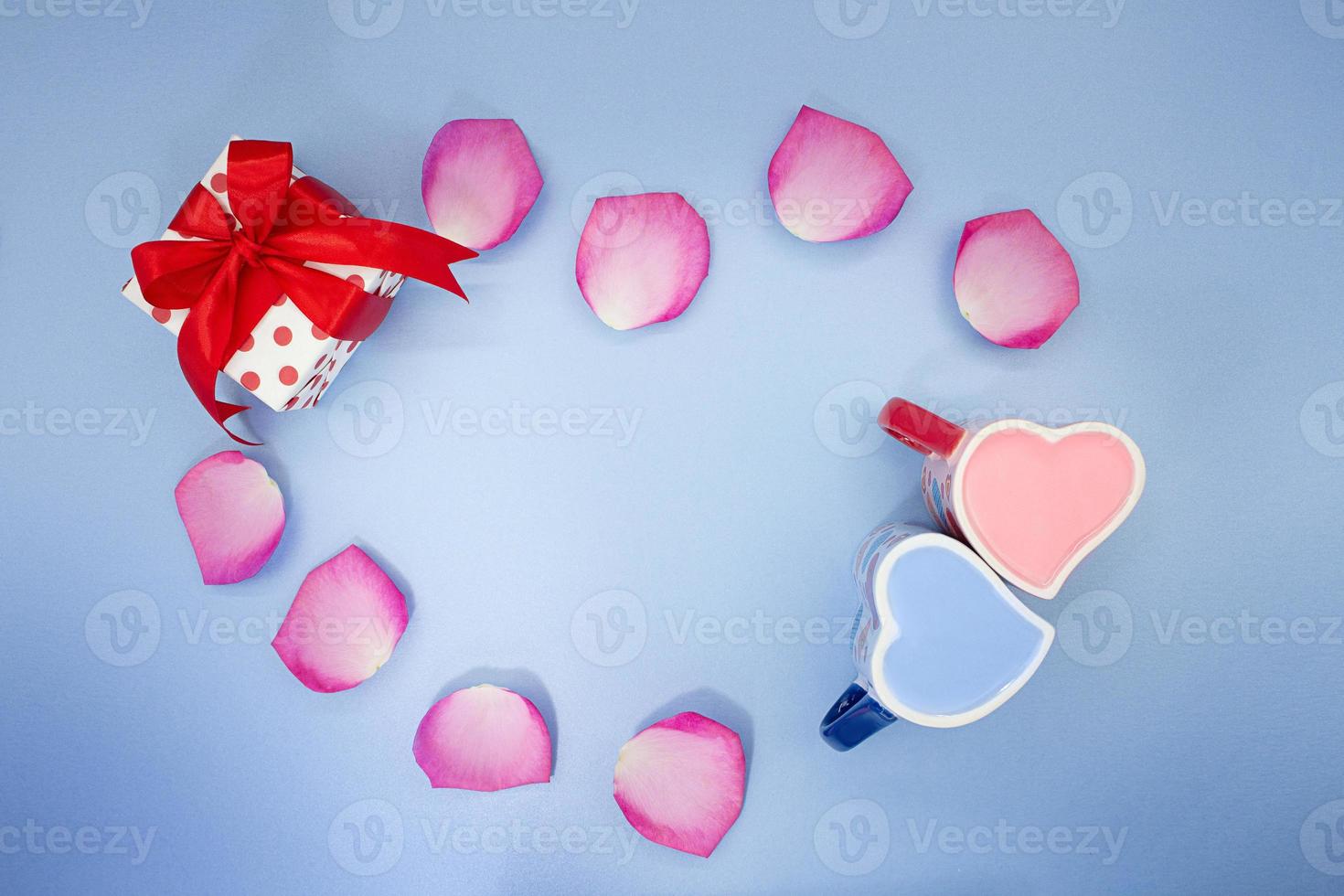 Heart of rose petals, gift boxes with bow. Valentine's day, gentle spring background. Copy space photo