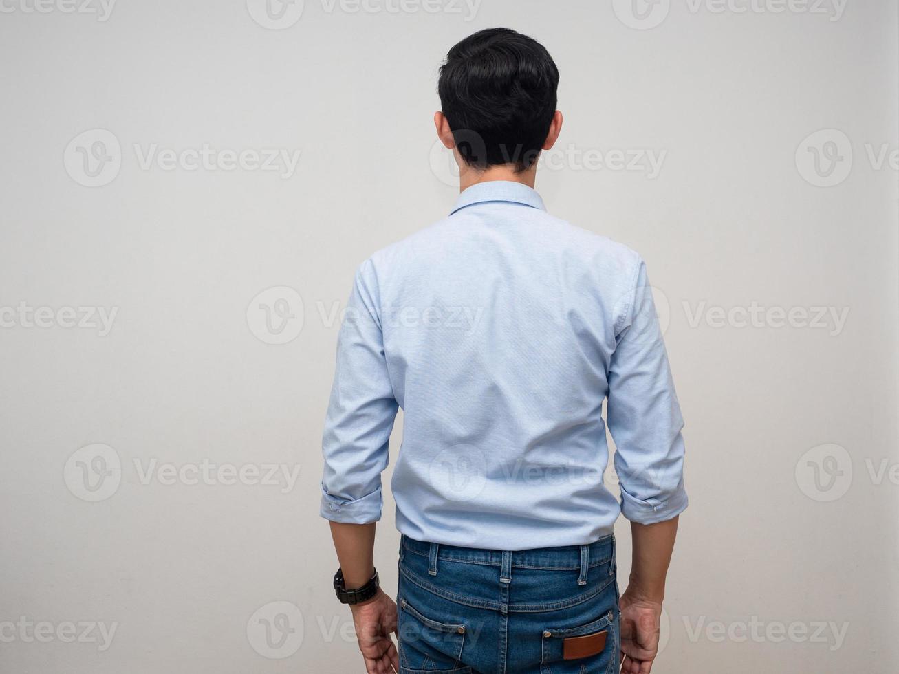 Backside of businessman blue shirt,Man standing turn back white background photo