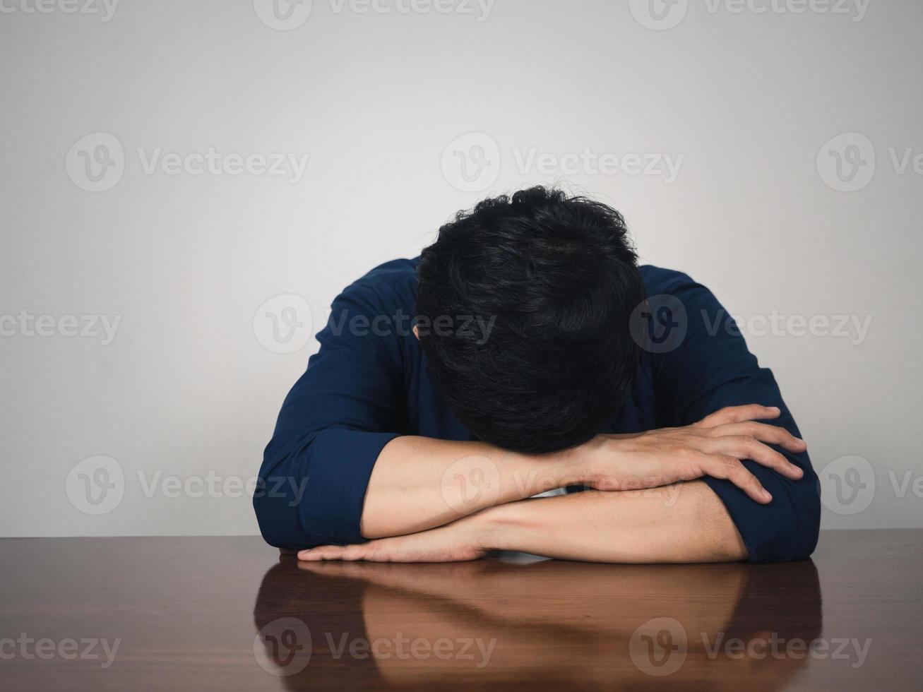 Sadness man sit at table,Depressed man photo