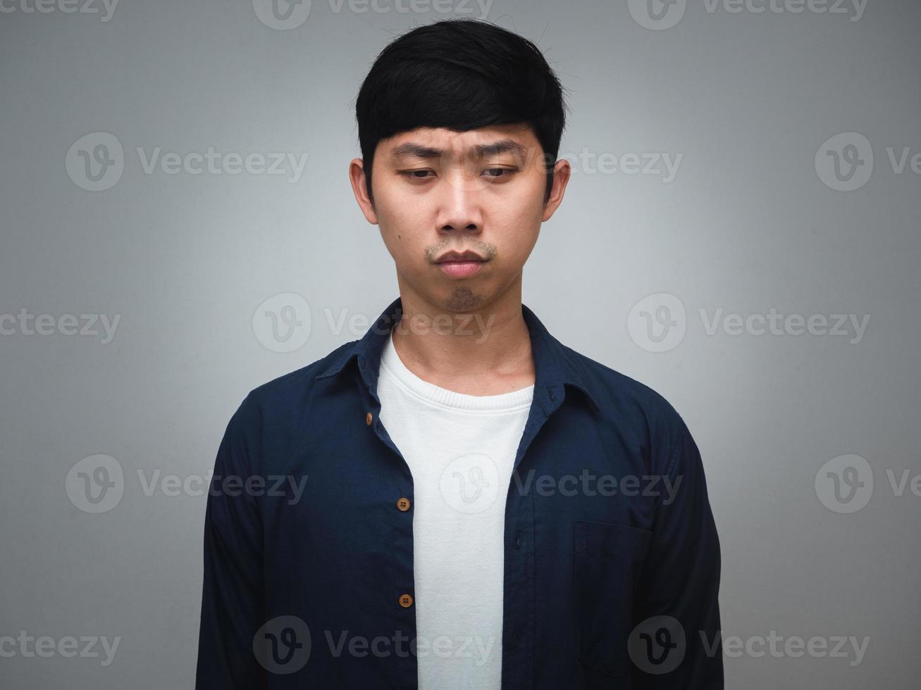 Sadness asian man feels depressed about bad life isolated photo