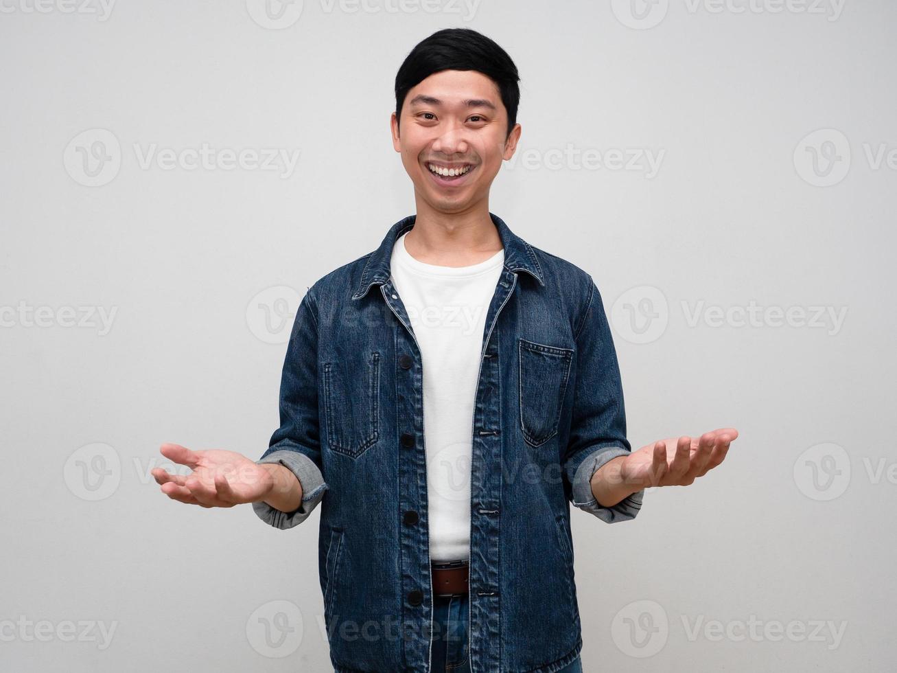 Positive cheerful man jeans shirt smile show hands up isolated photo