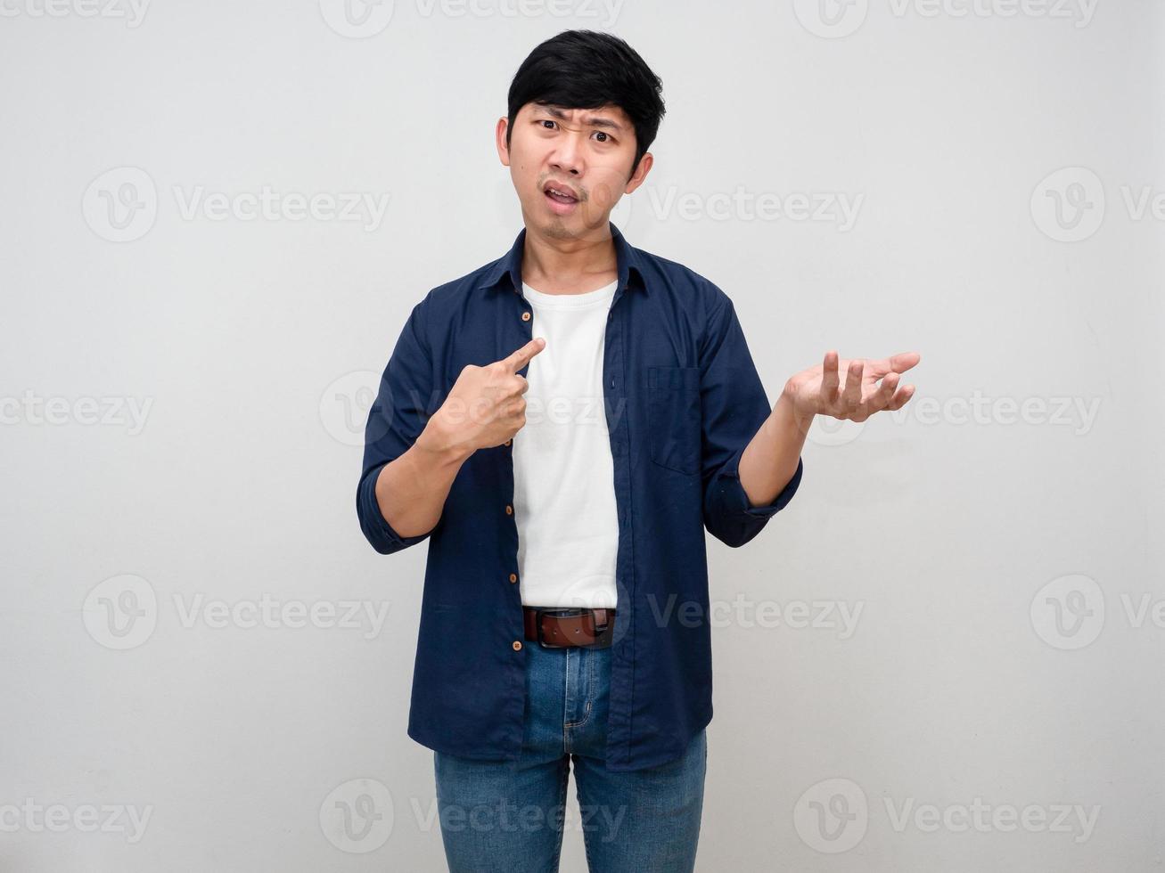Negative asian businessman feels confused point finger at himself about me again isolated photo