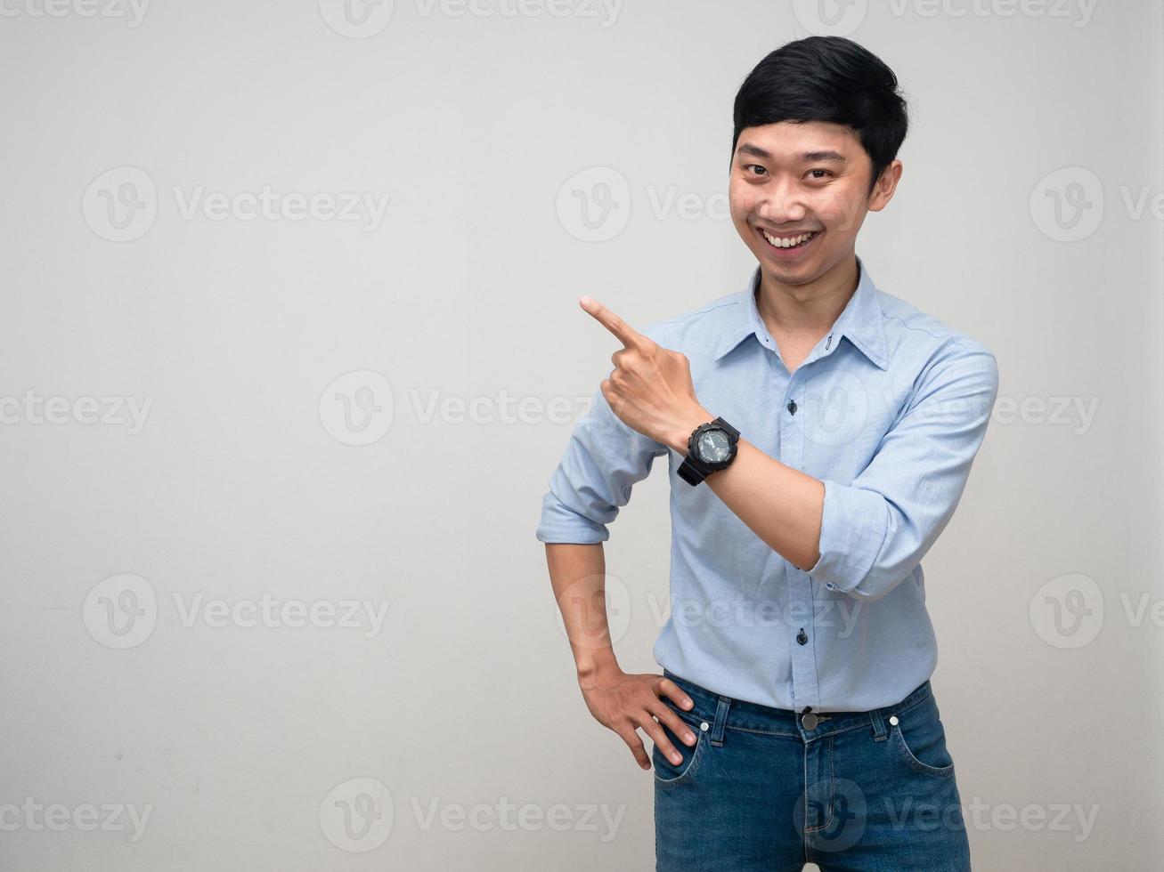 Cheerful man happy smile gesture point finger studio shot white background photo