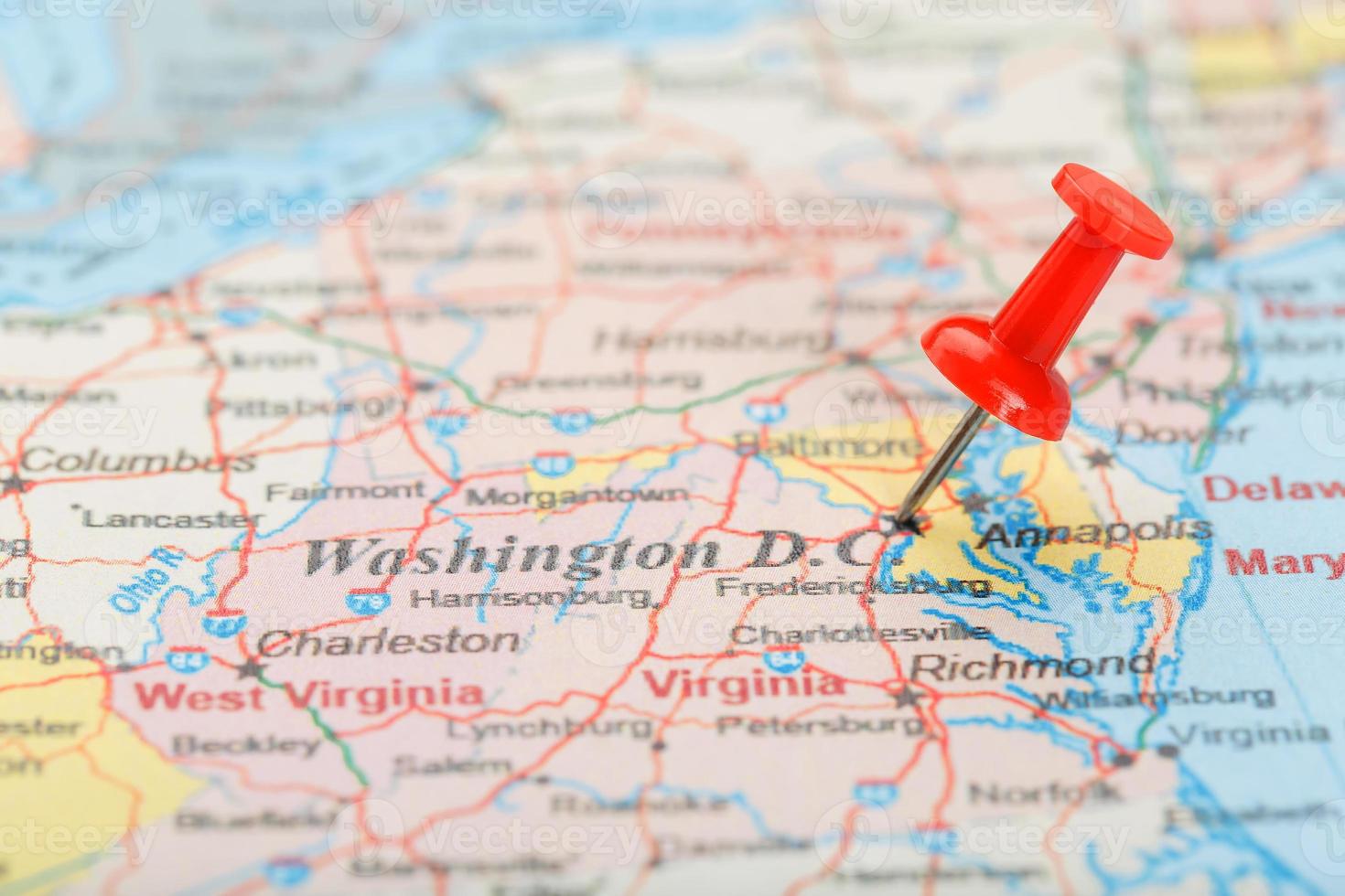 Red clerical needle on the map of USA, South Washington, DC and the capital of Richmond. Close up map of DC with red tack photo