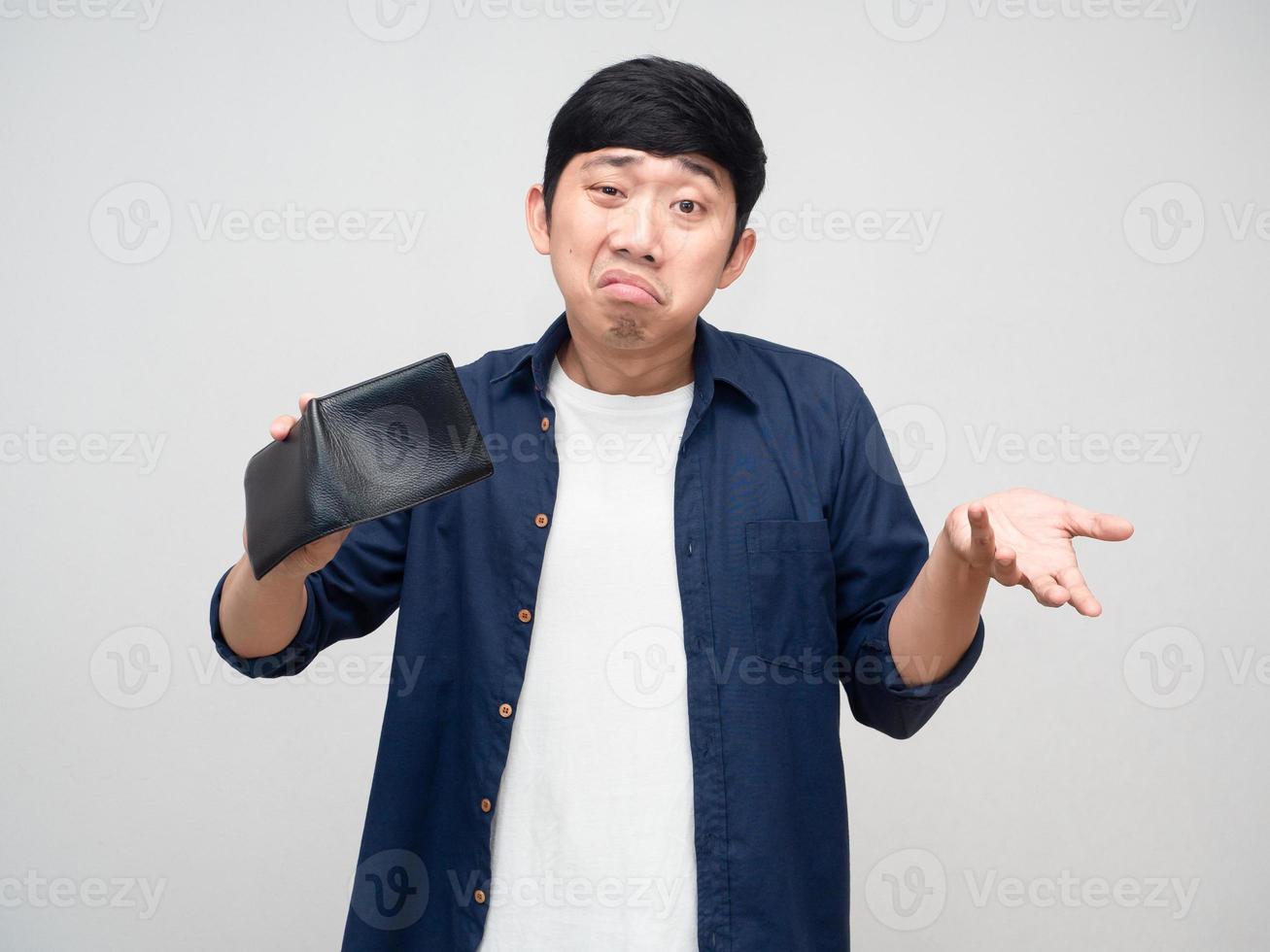 Asian poor man show empty wallet feels bored isolated photo