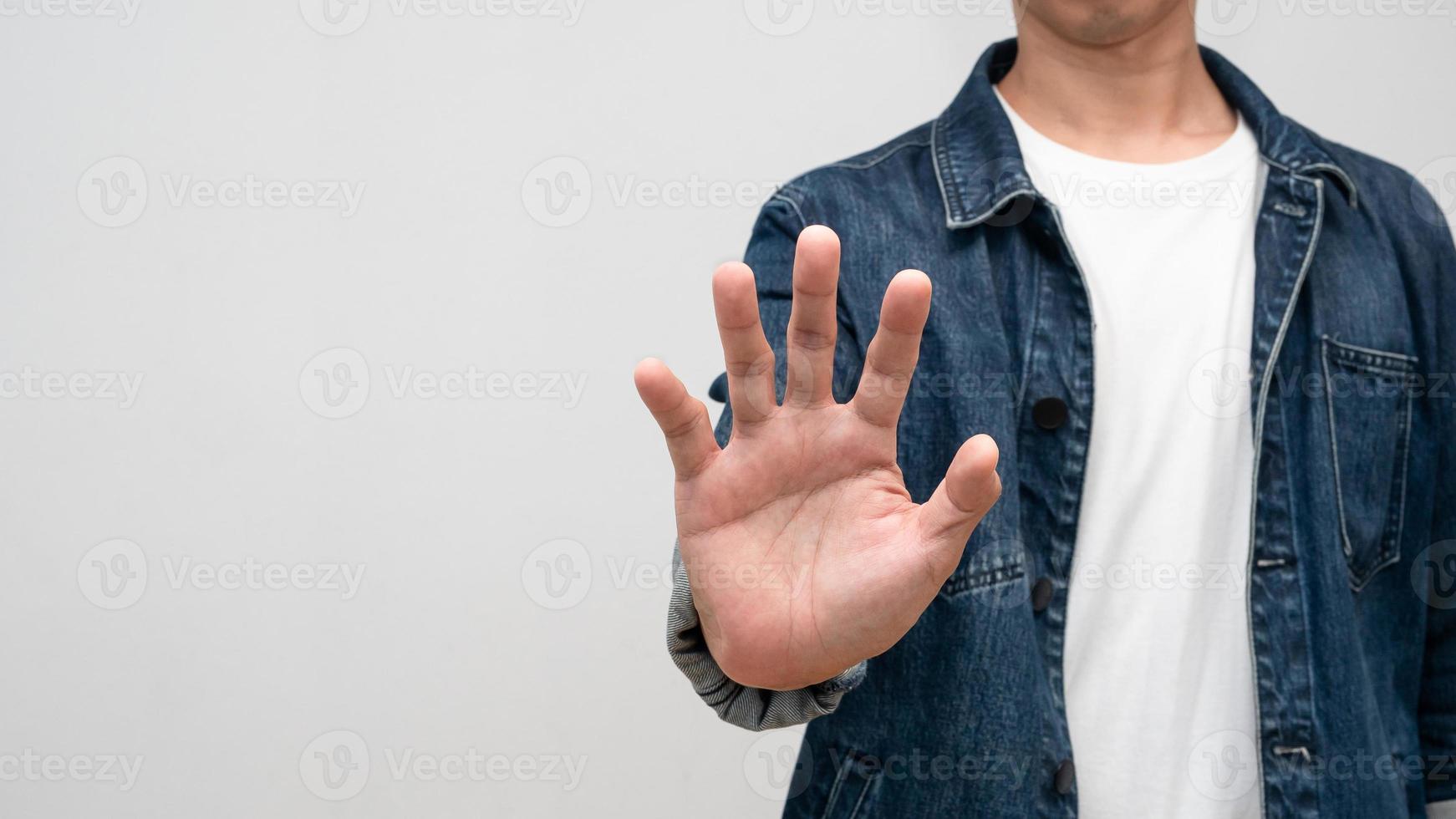 Close up man show hand stop studio shot isolated photo