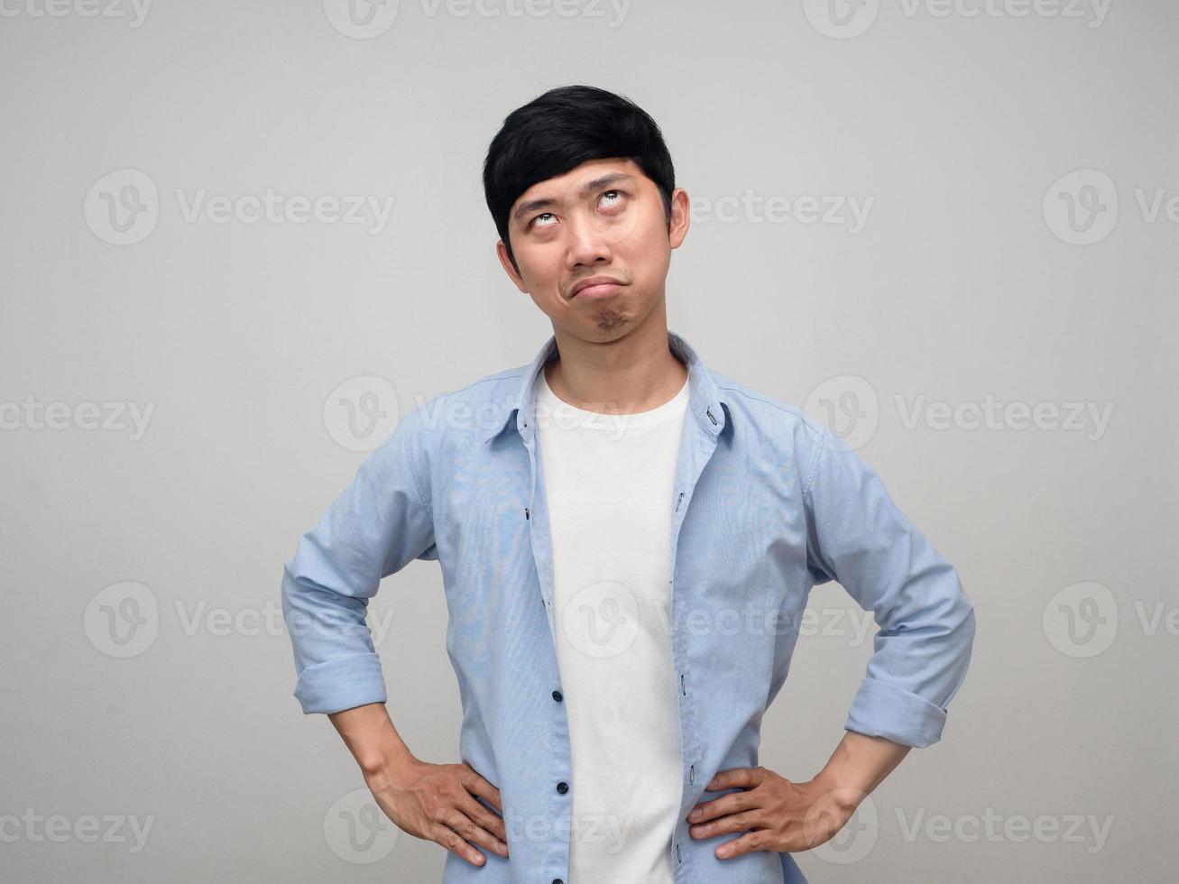 Asian man posing hands at waist feels jealous at his face isolated photo