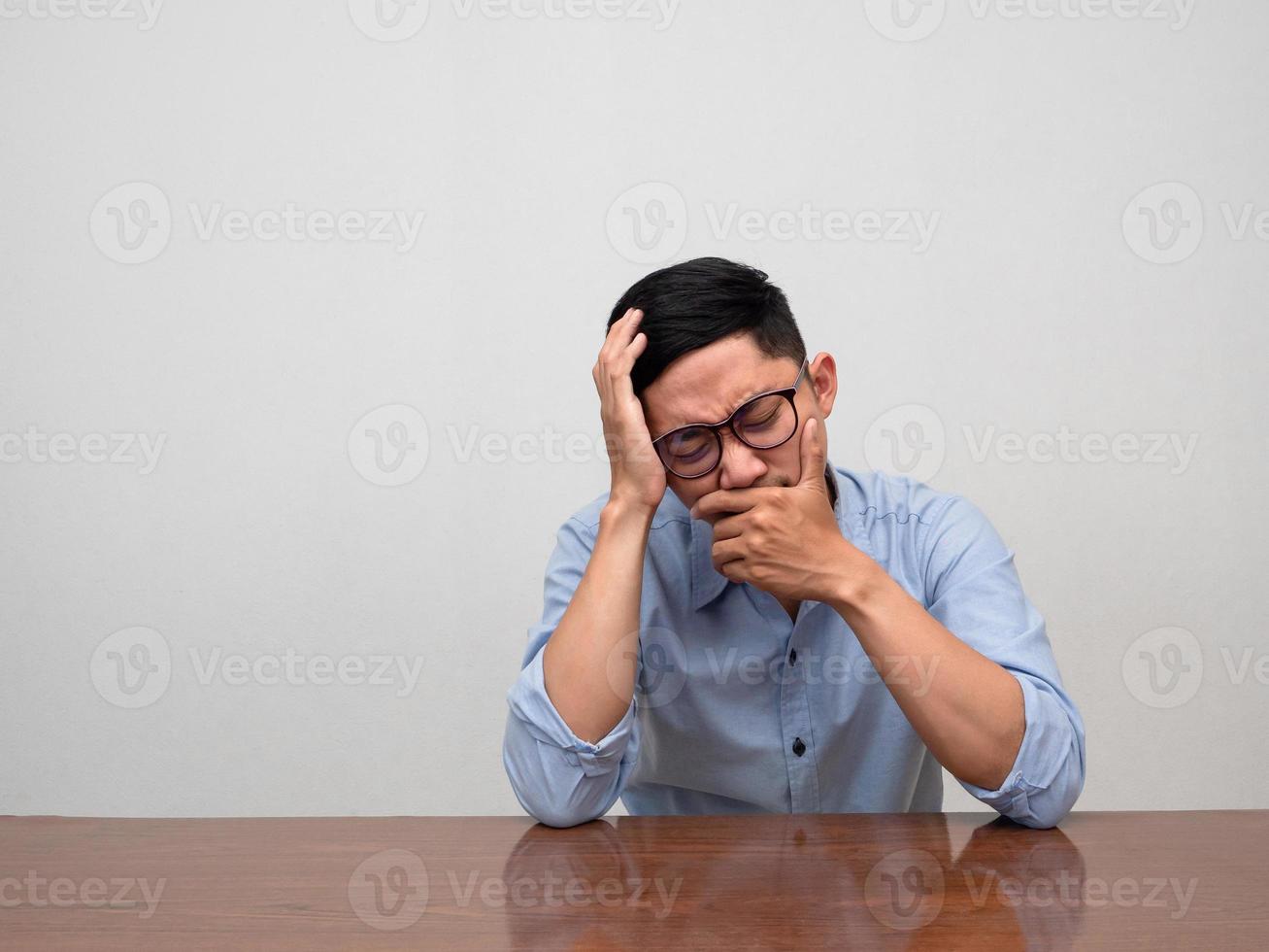 Sadness businessman sit alone crying and disheartened photo