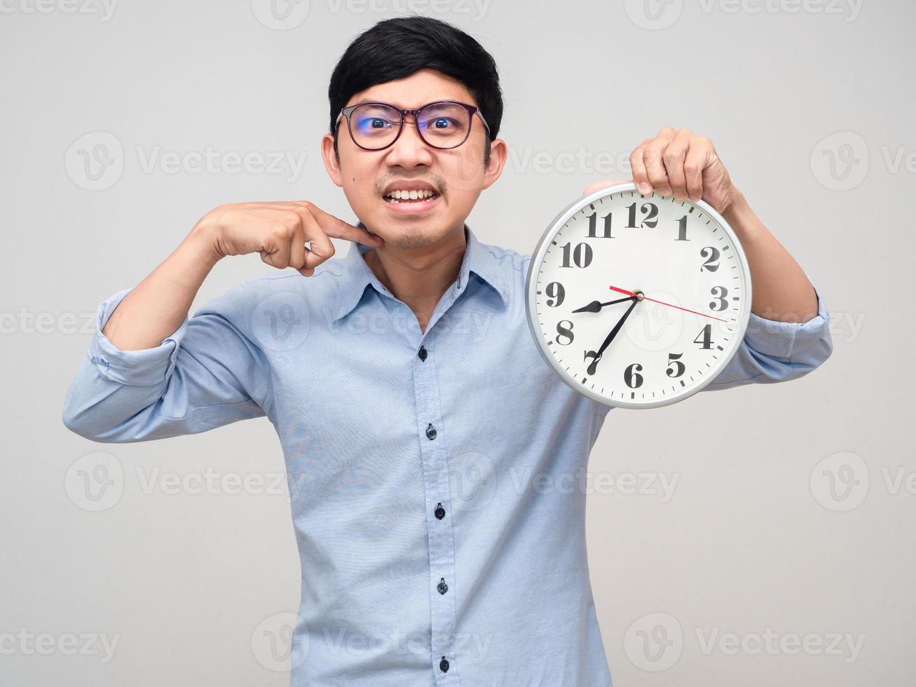 Angry manager man show analog clock gesture finger cut his neck isolated photo
