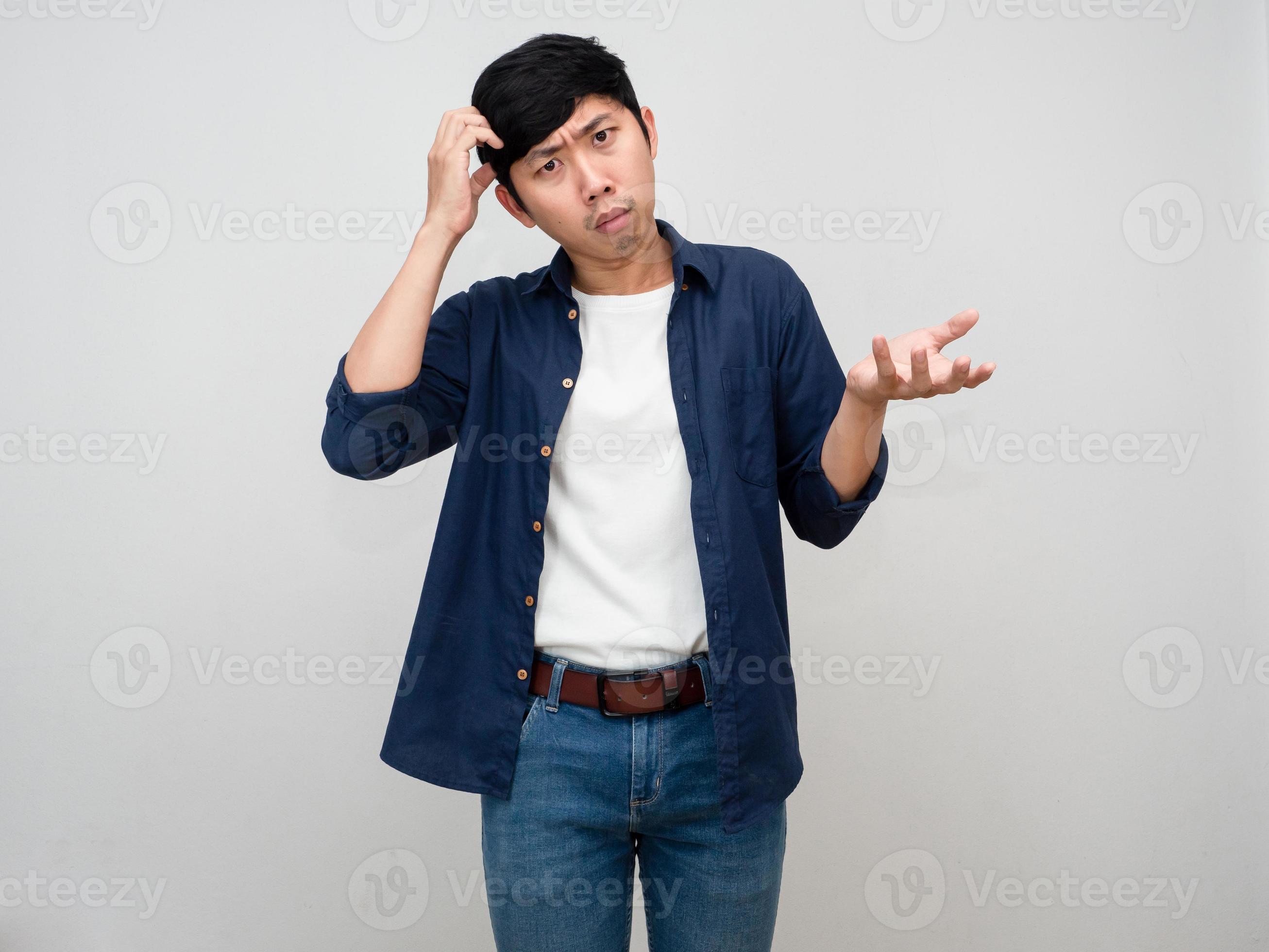Asian man standing gesture scratch head feels doubt and confused