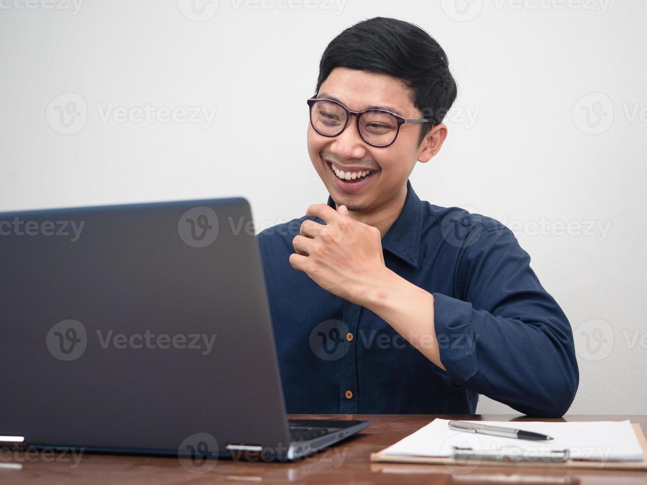 Businessman happy with his work,Video call for working on table photo