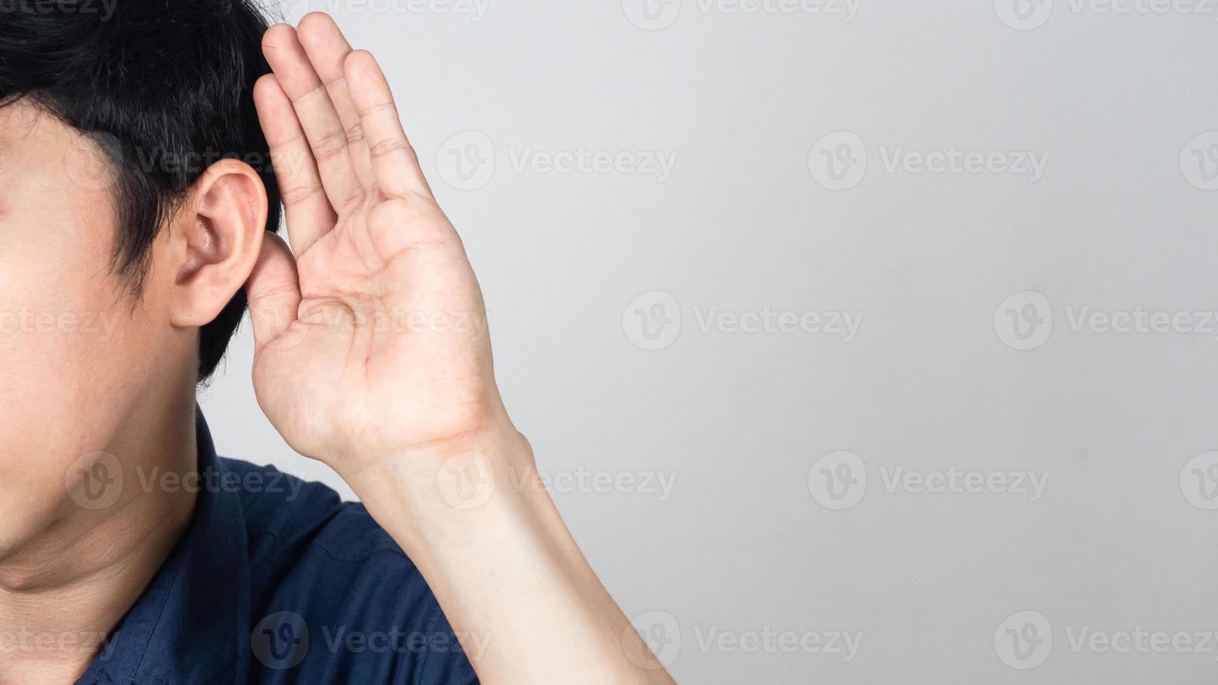 Close-up man gesture listening isolated studio shot photo