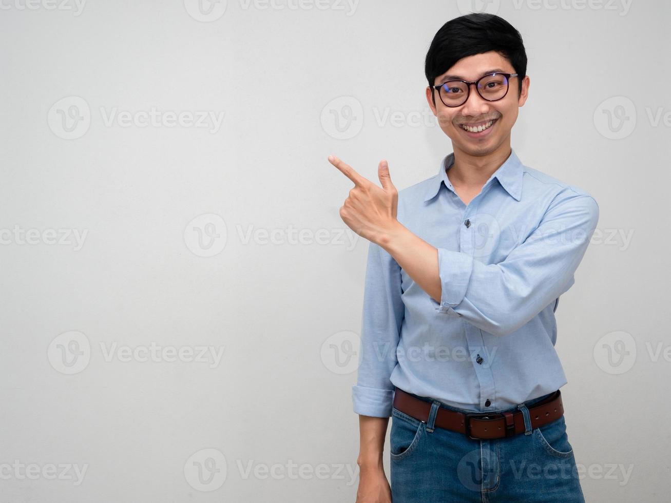 Portrait manager man blue shirt smiling show hand point finger isolated photo