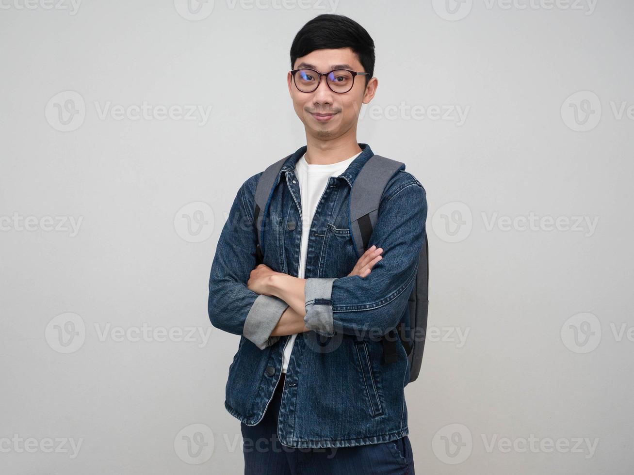 Handsome asian man jeans shirt wear glasses crossing arms confident looking at you isolated studio shot photo