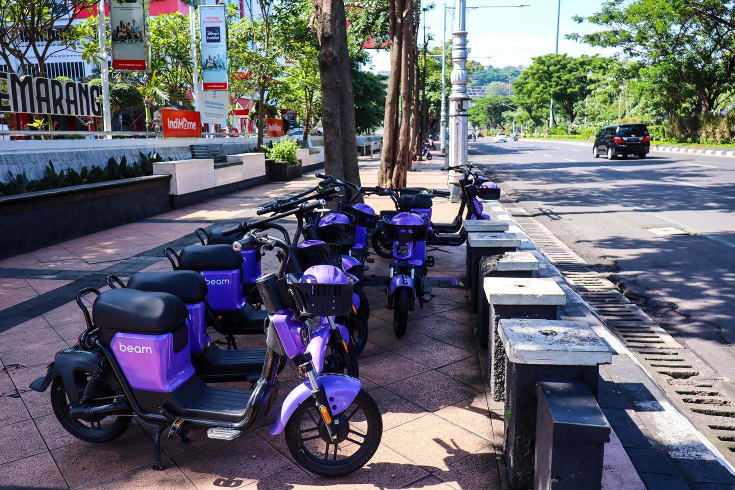 Semarang, Indonesia December 2022. Beam Rover electric bicycles or e-bikes, neatly lined up on the side of the road for rent. photo