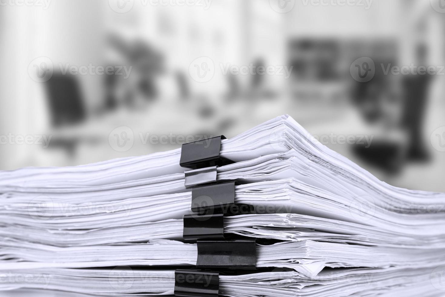 Stacks of papers on the desk in the office. business office. Reporting period. photo