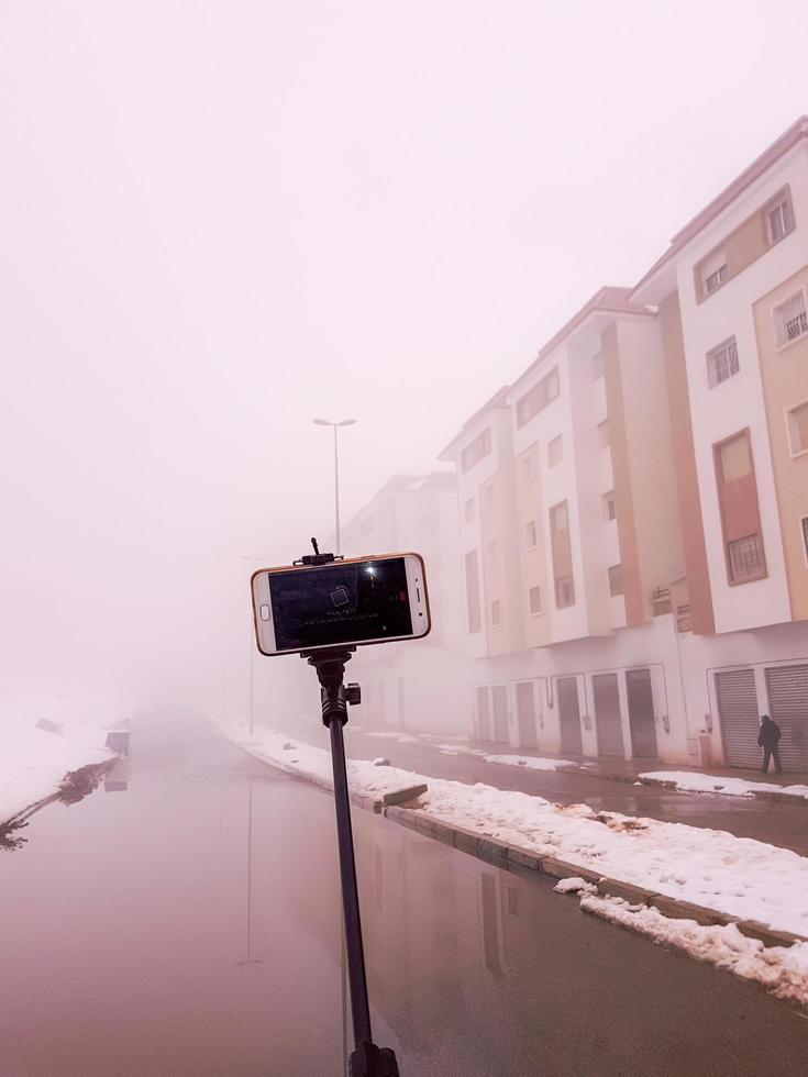 Selfie stick in a deep cloud photo