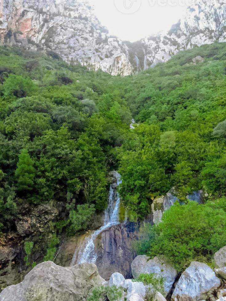 Waterfall in the mountains photo