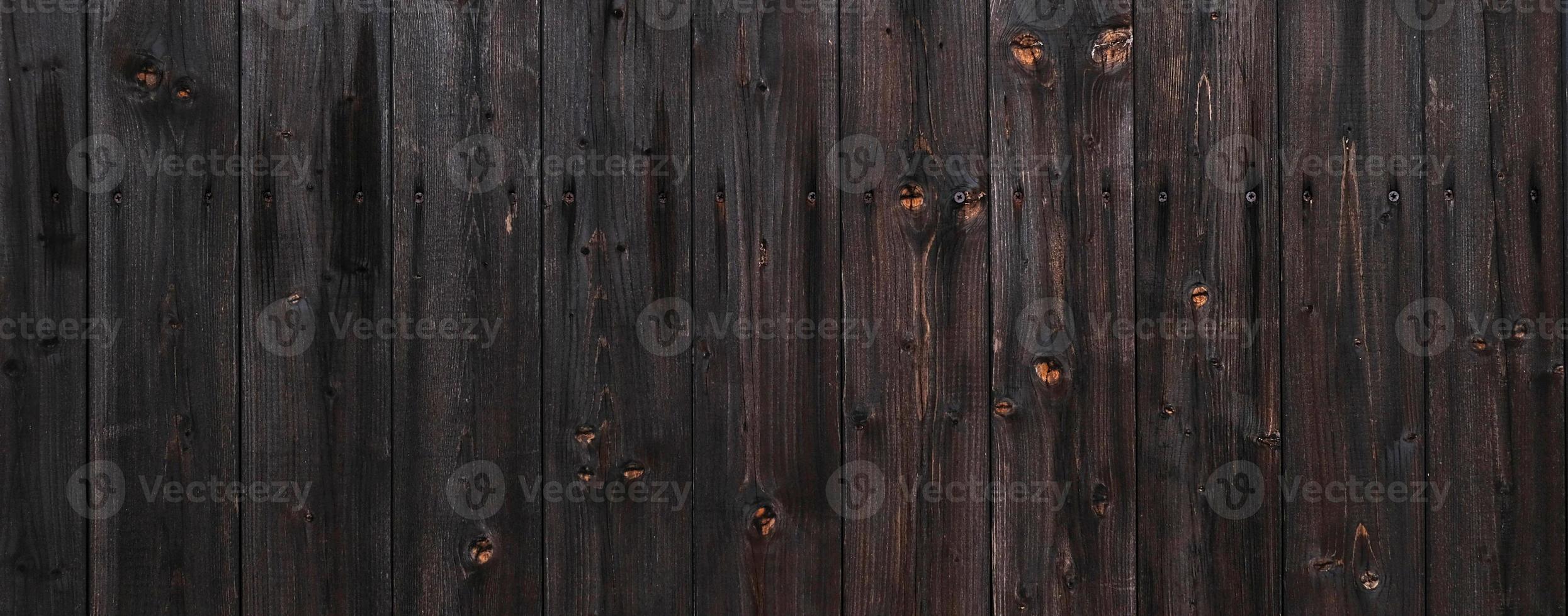 Natural Dark Wooden Background. Wooden rustic background. Old boards. Copy space for your text or image. Top view. Dark brown wood boards. Blank for design and require a wood grain. photo