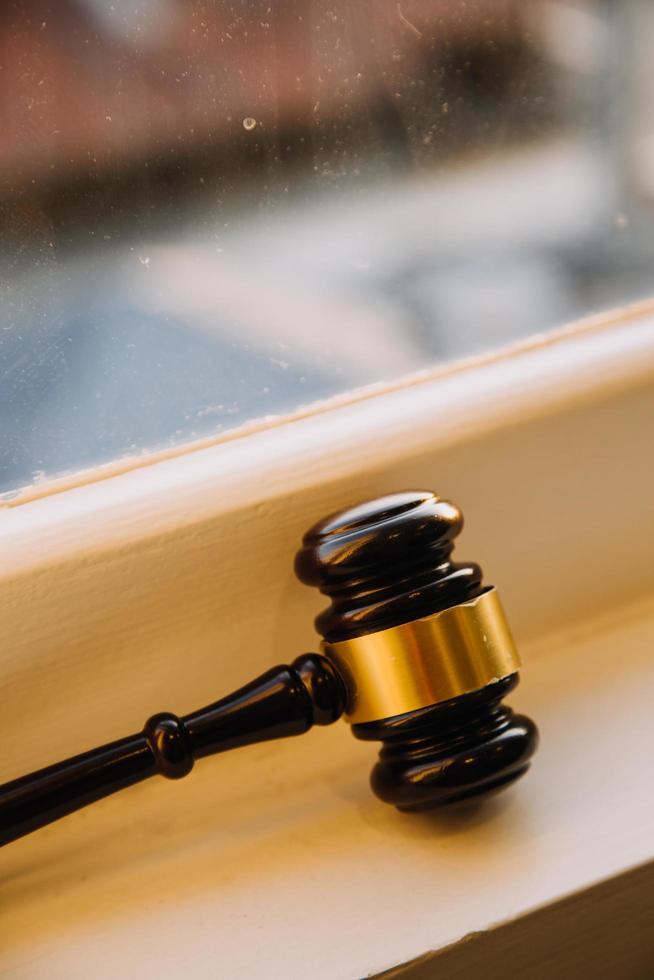 Business and lawyers discussing contract papers with brass scale on desk in office. Law, legal services, advice, justice and law concept picture with film grain effect photo