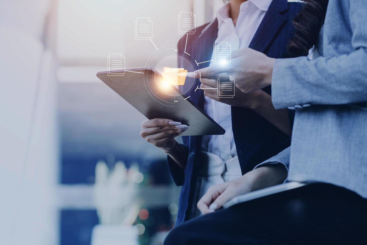 Document management system concept, business man holding folder and document icon software, searching and managing files online document database, for efficient archiving and company data. photo