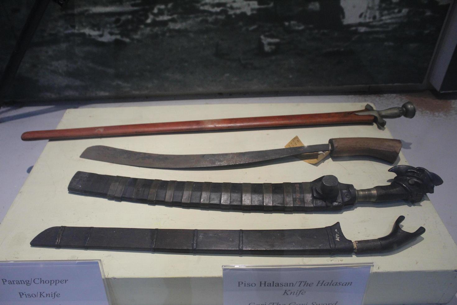 a collection of several historical machetes, historical machetes in the museum photo