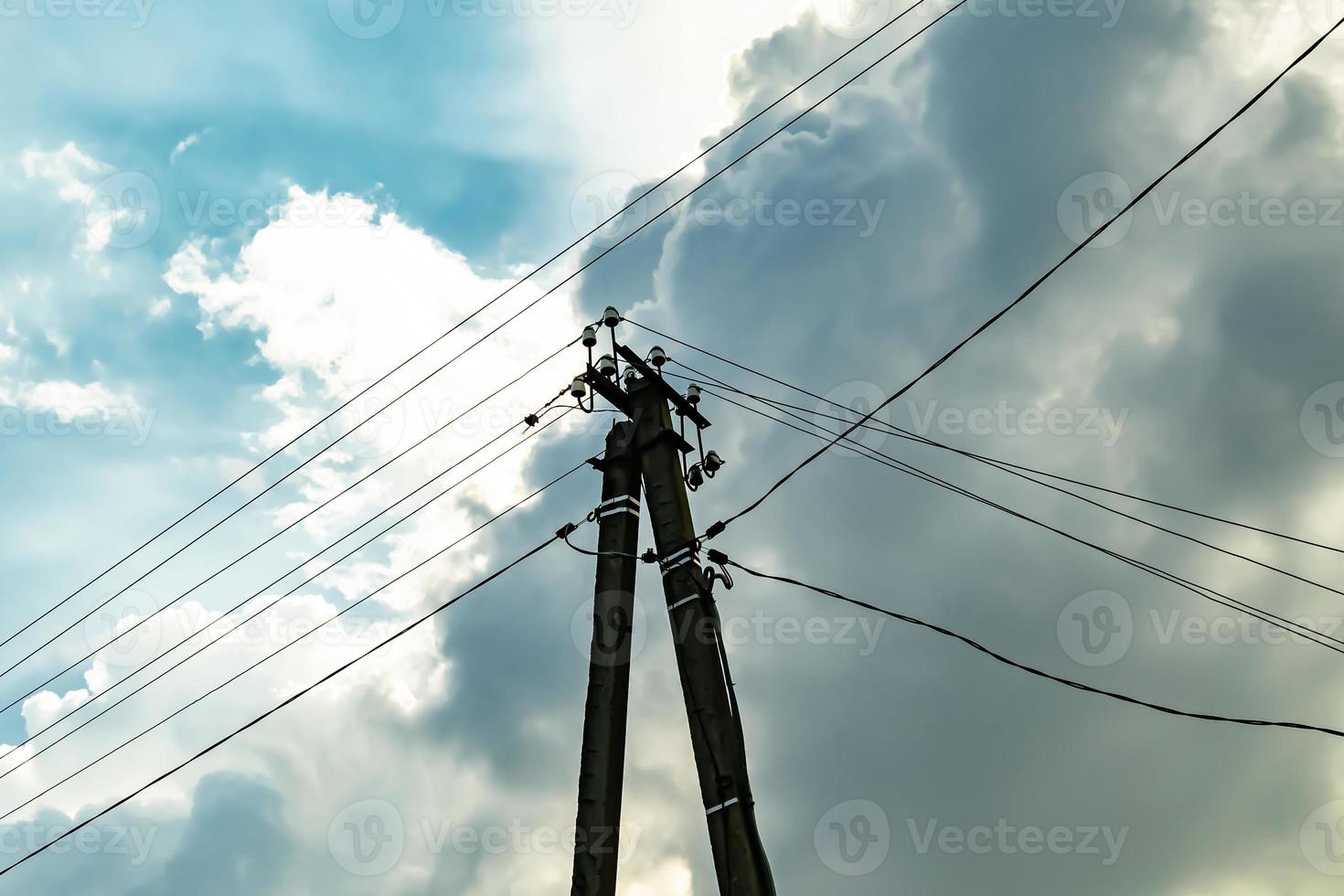 Power electric pole with line wire on colored background close up photo