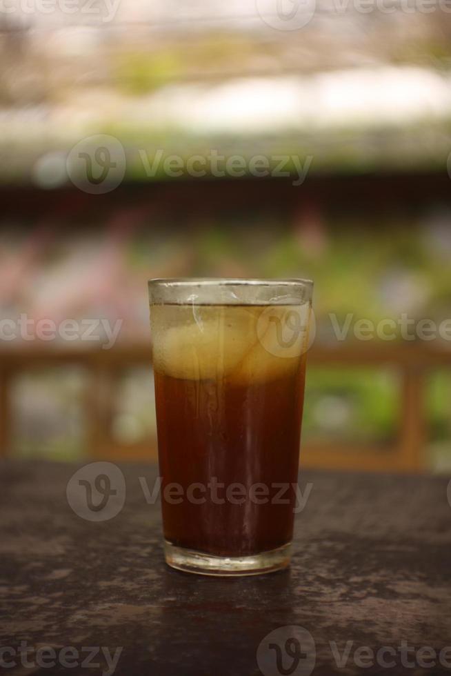 sweet fresh iced tea with blur background. photo