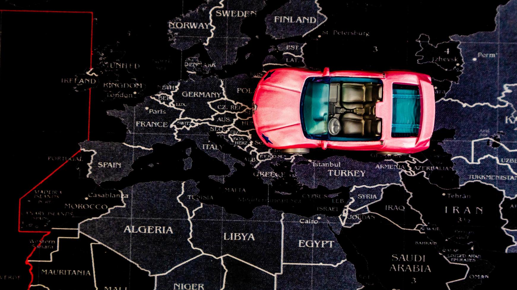 Minahasa, Indonesia  December 2022, pink toy car over map photo
