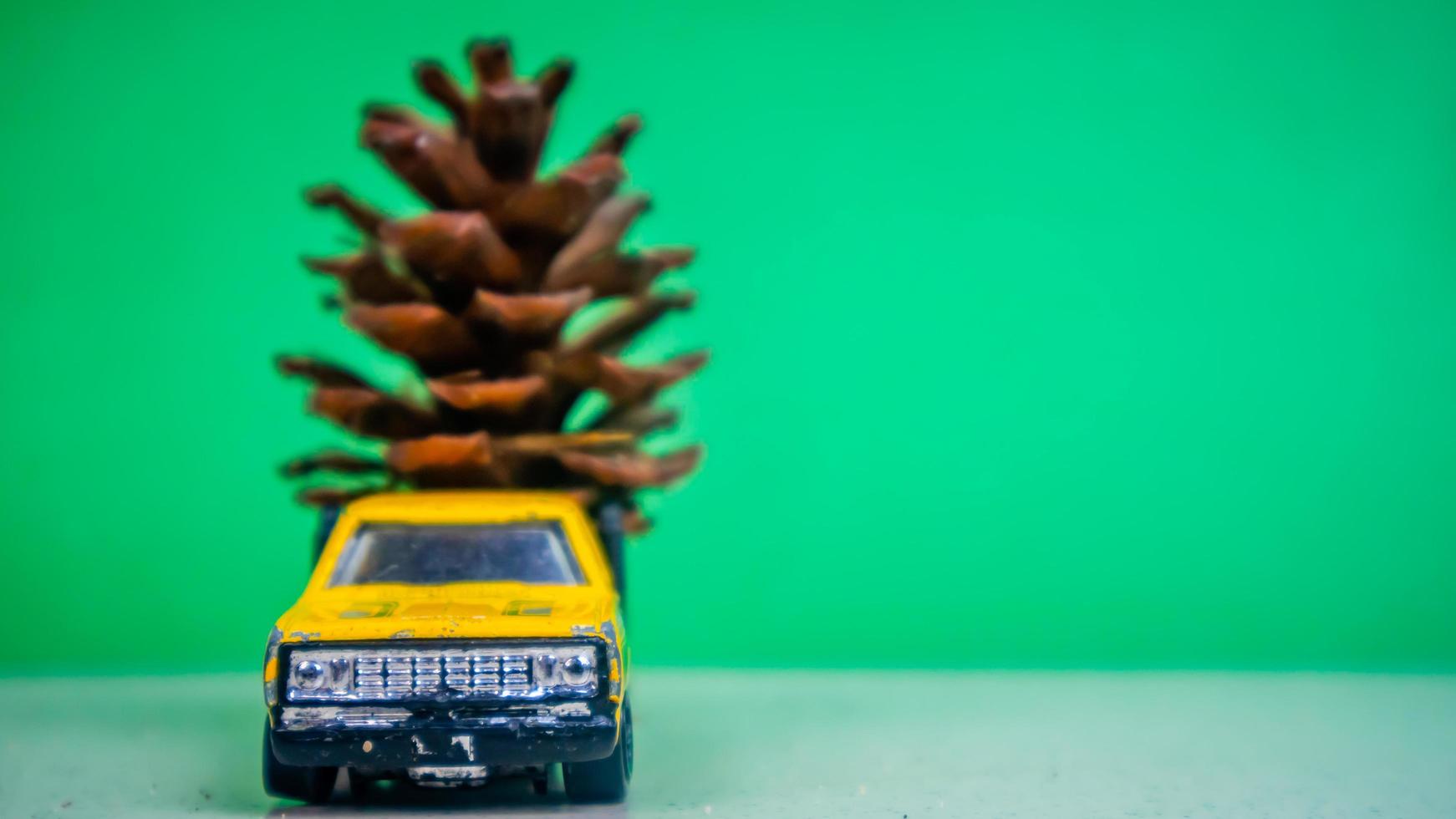 Minahasa, Indonesia  December 2022, the toy car transporting pinecones photo