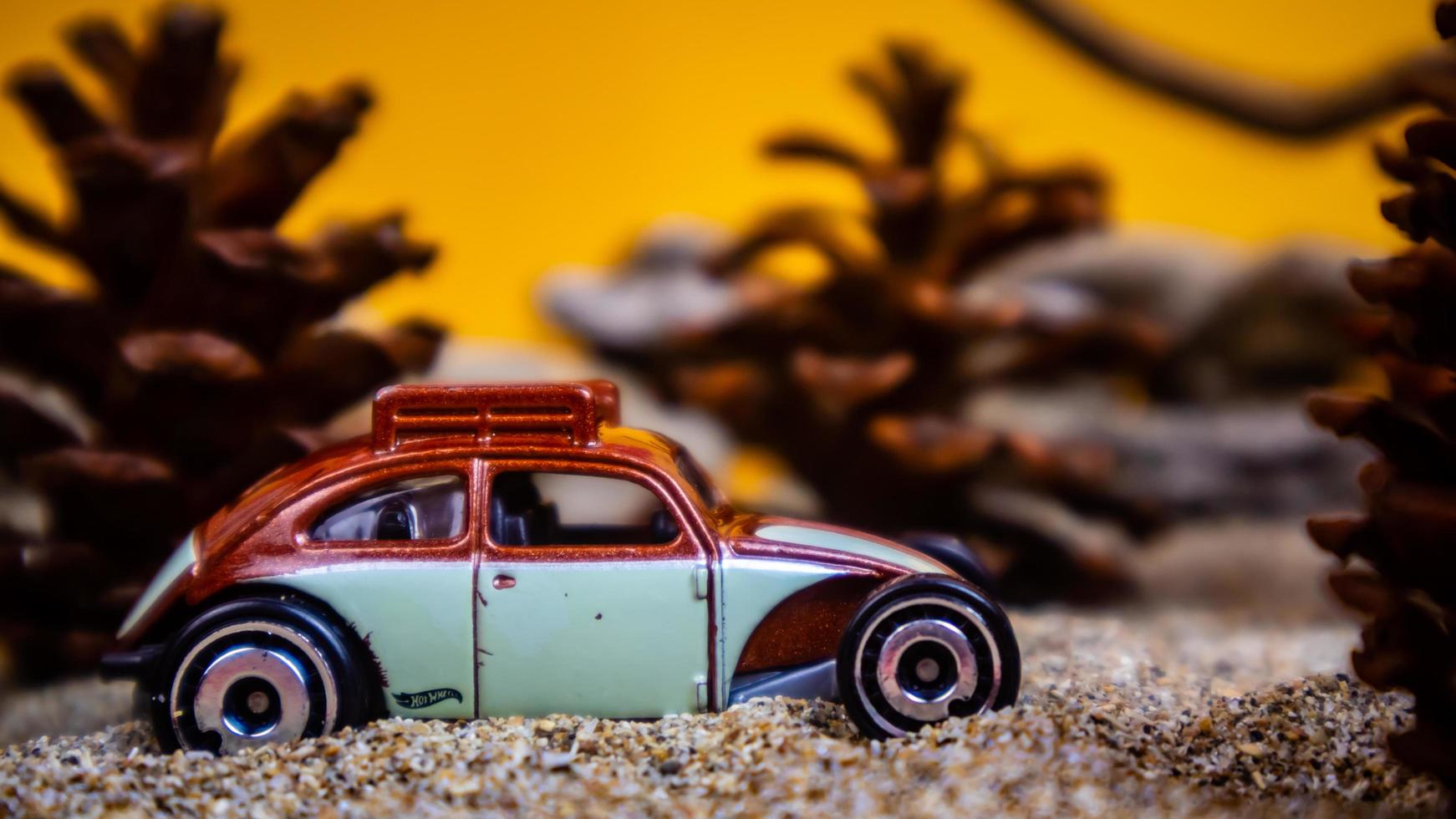 Minahasa, Indonesia  December 2022, the toy car among the pine cones photo