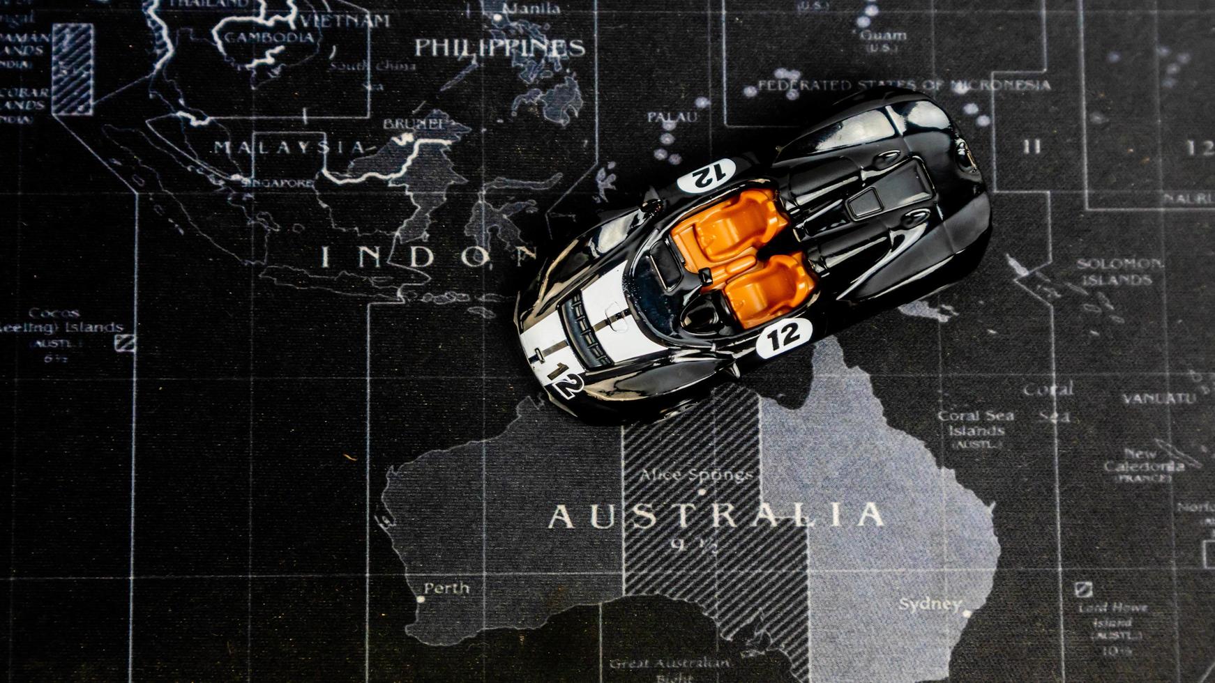 Minahasa, Indonesia December 2022, toy car is black over the map photo