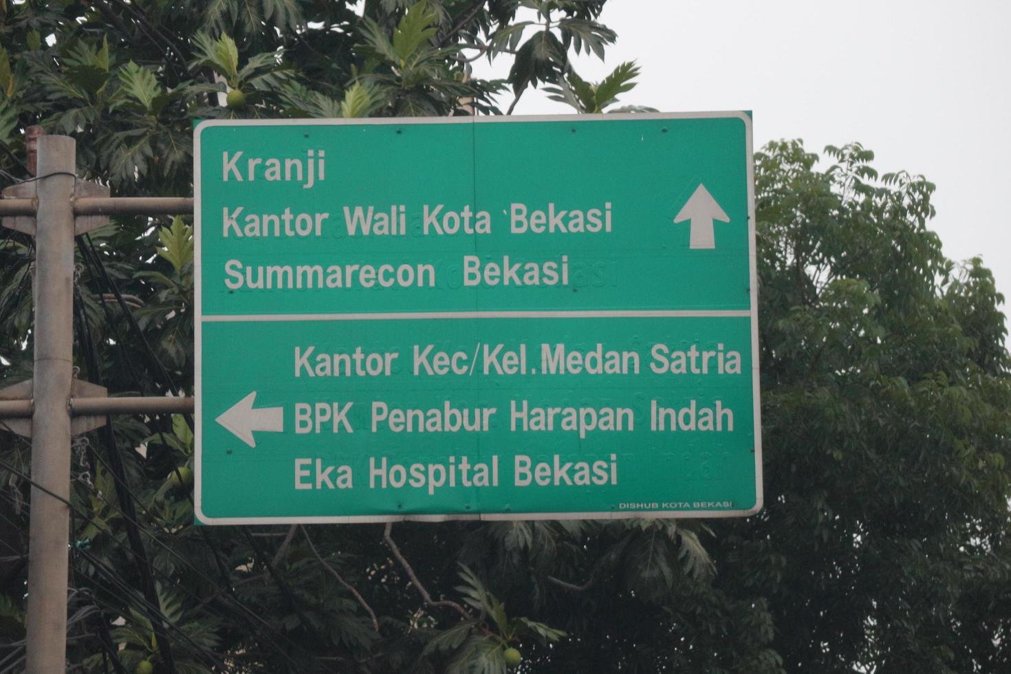 Bekasi, Indonesia on July 2022. Road signs to Kranji, Bekasi Mayor's Office, Summarecon Bekasi, Medan Satria photo