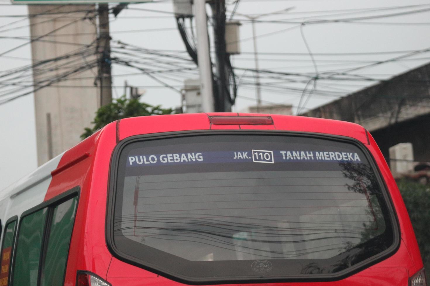 Jakarta, Indonesia in July 2022. Public transportation is in the form of a small passenger car owned by the DKI Jakarta government photo