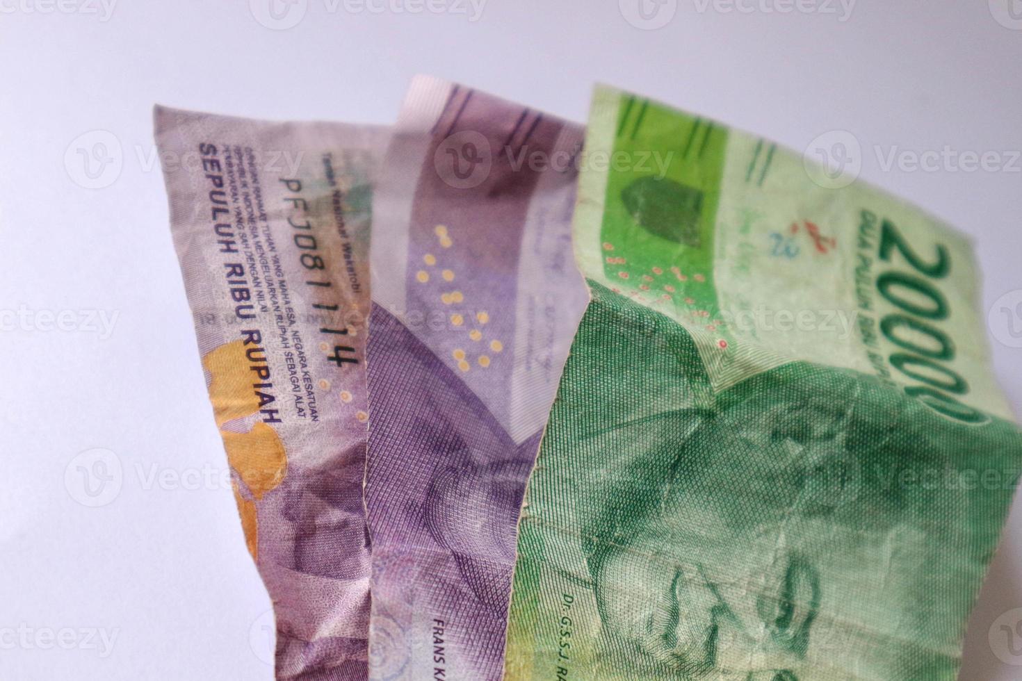 two ten thousand bills and one twenty thousand bill. photo