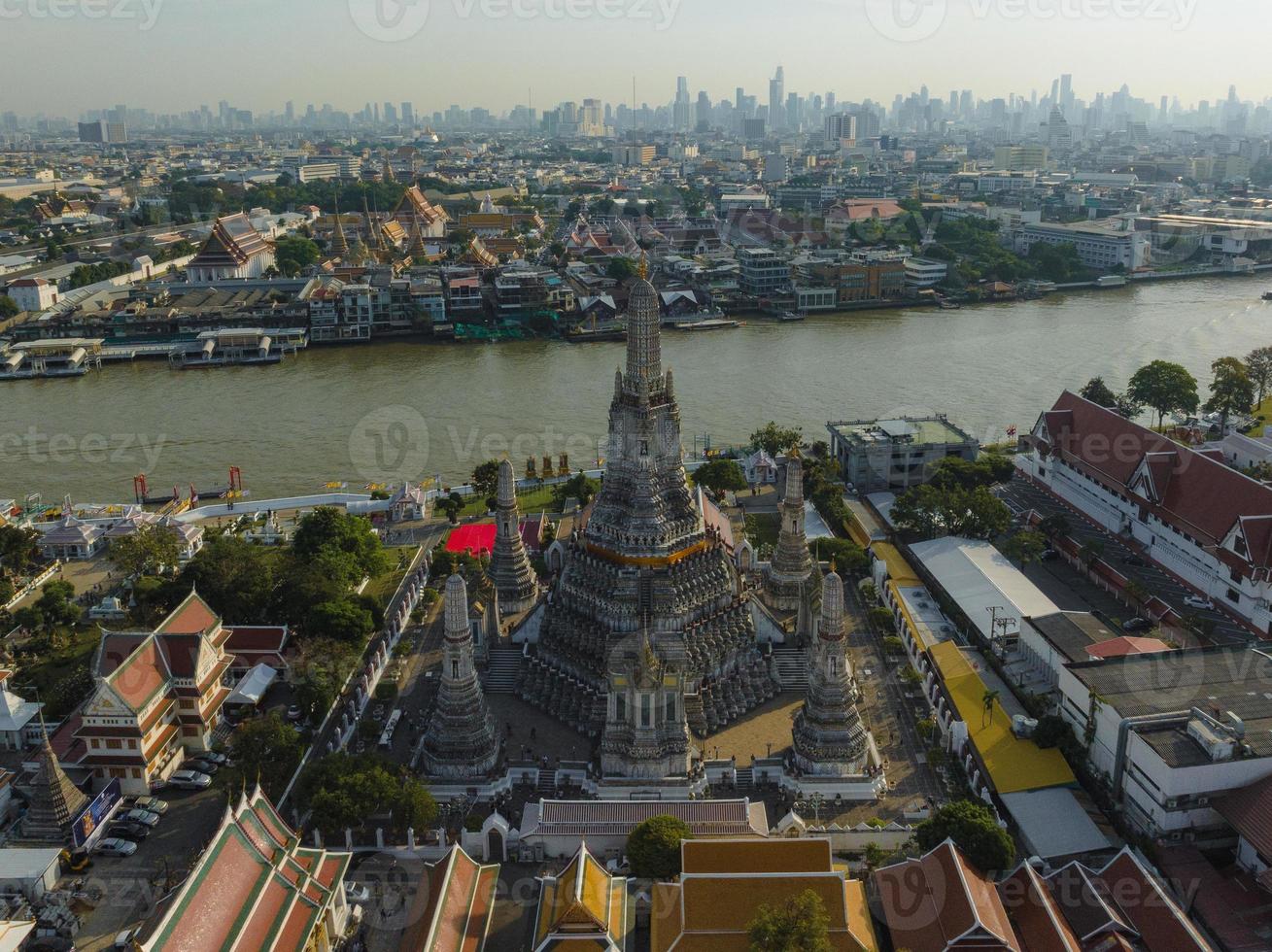 An aerial view of the Pagoda stands prominently at Wat Arun Temple with Chao Phraya River, The most famous tourist attraction in Bangkok, Thailand photo