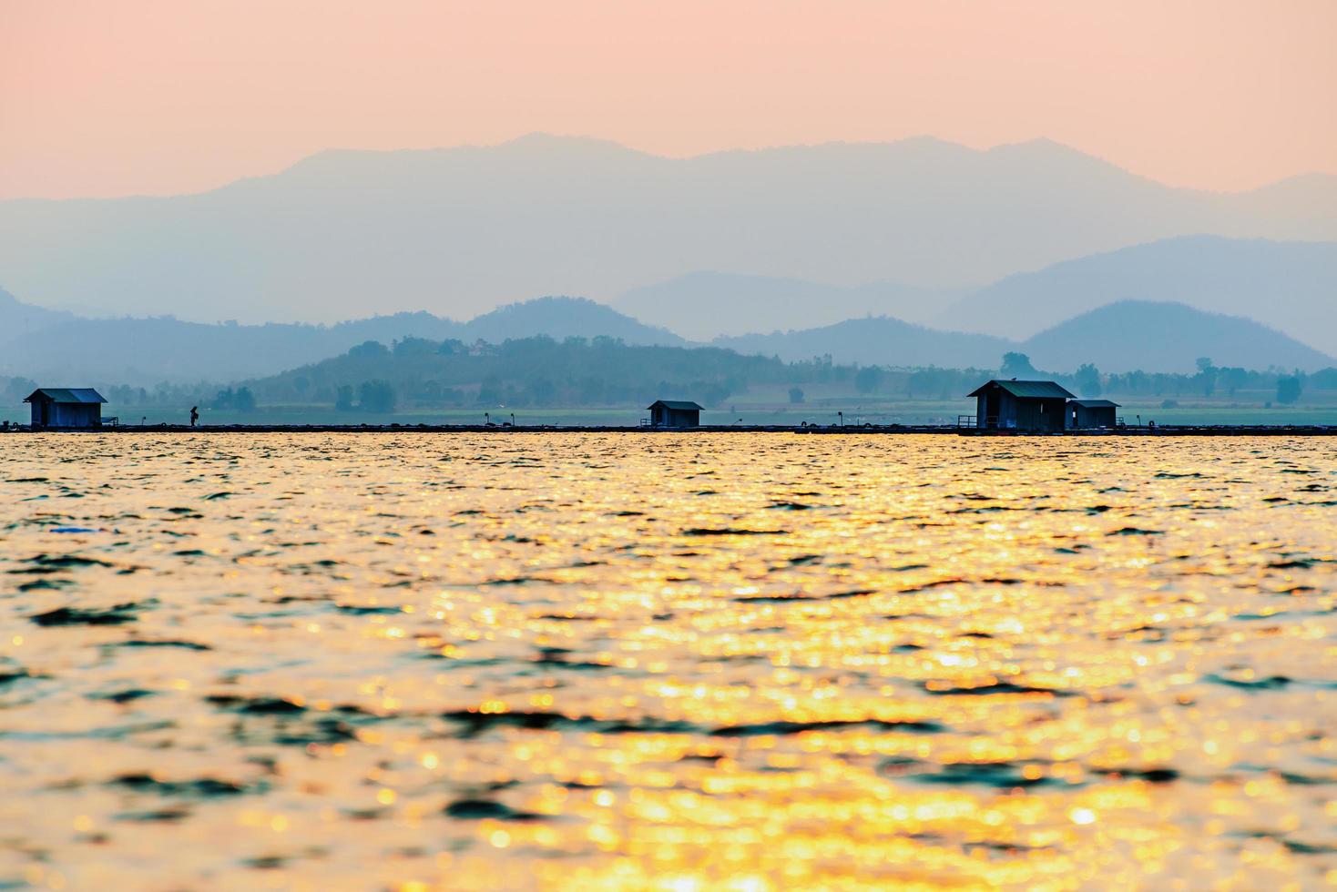 Silhouette fish farming cages in a rural lifestyle photo