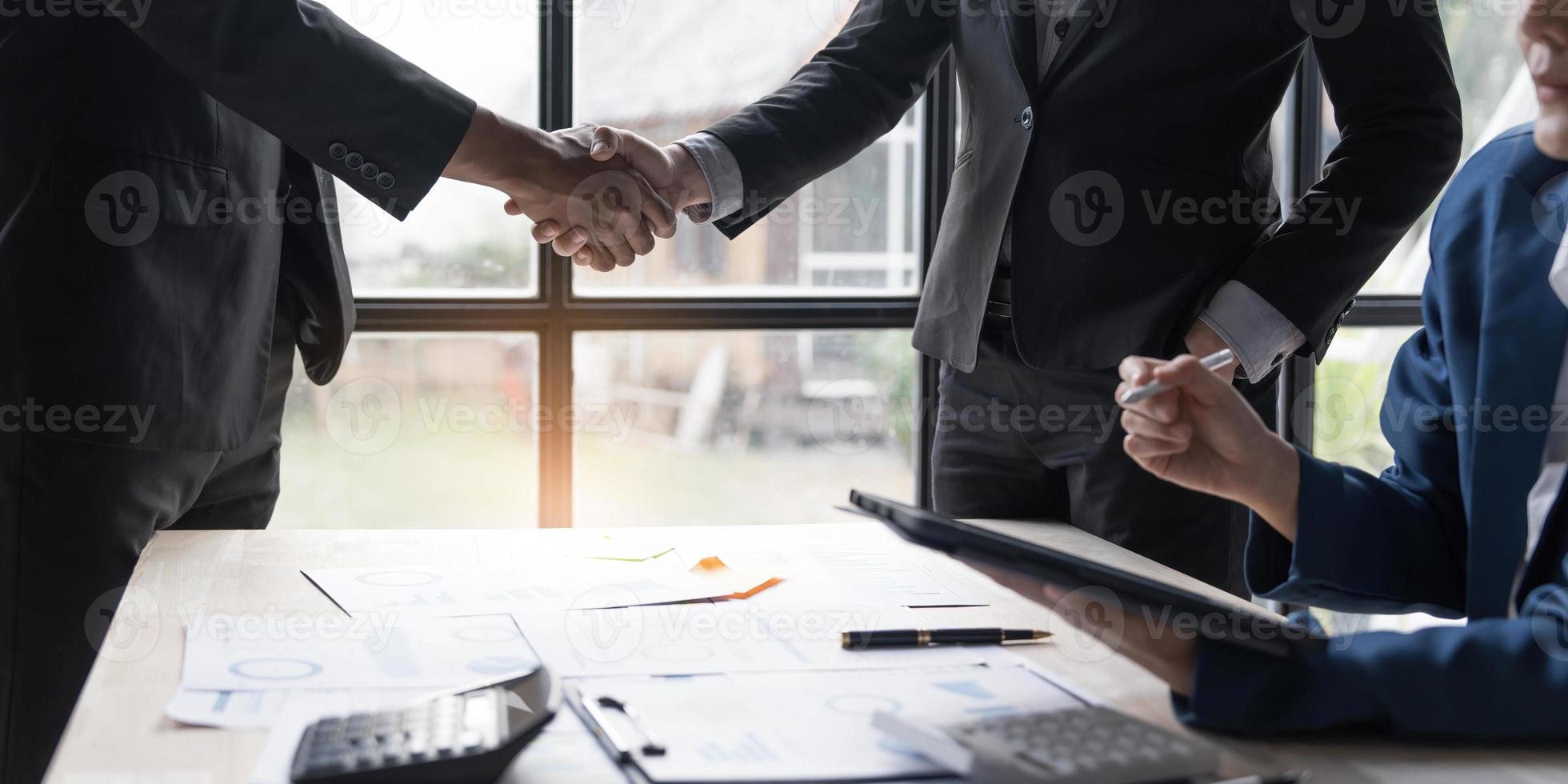 Business handshake for teamwork of business merger and acquisition,successful negotiate,hand shake,two businessman shake hand with partner to celebration partnership and business deal concept photo