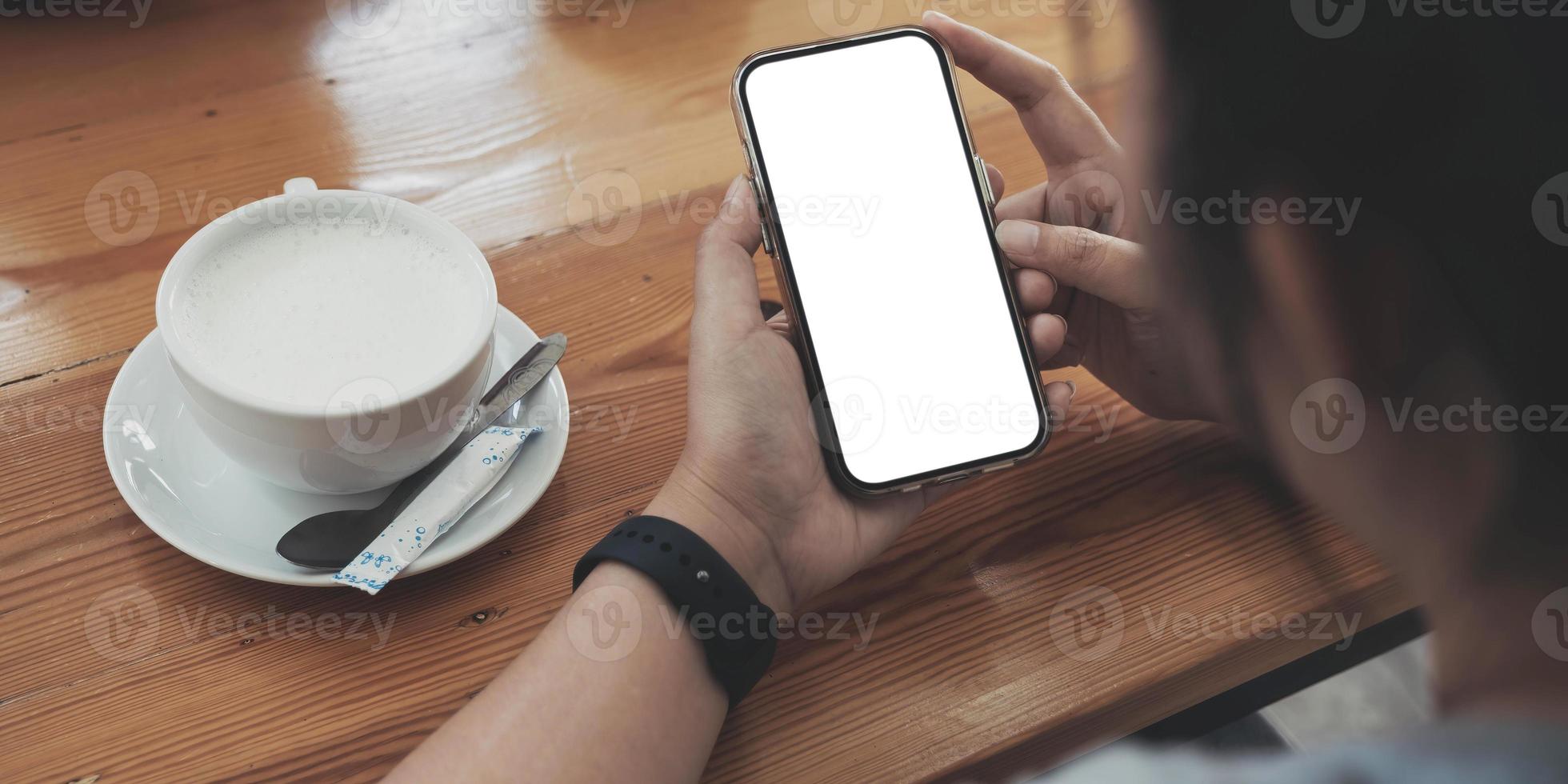 Close up of woman using cell phone,sending massages on the coffee shop.having sunbath.Phone with black screen,texting,video calls, photo