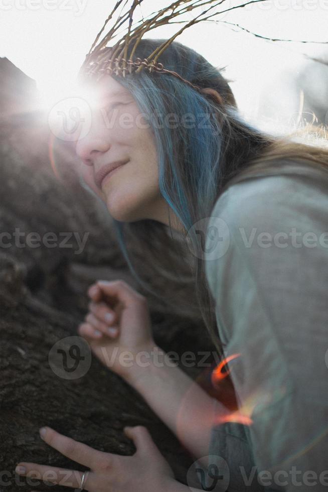 Close up celtic styled delighted woman face in bright sunlight portrait picture photo