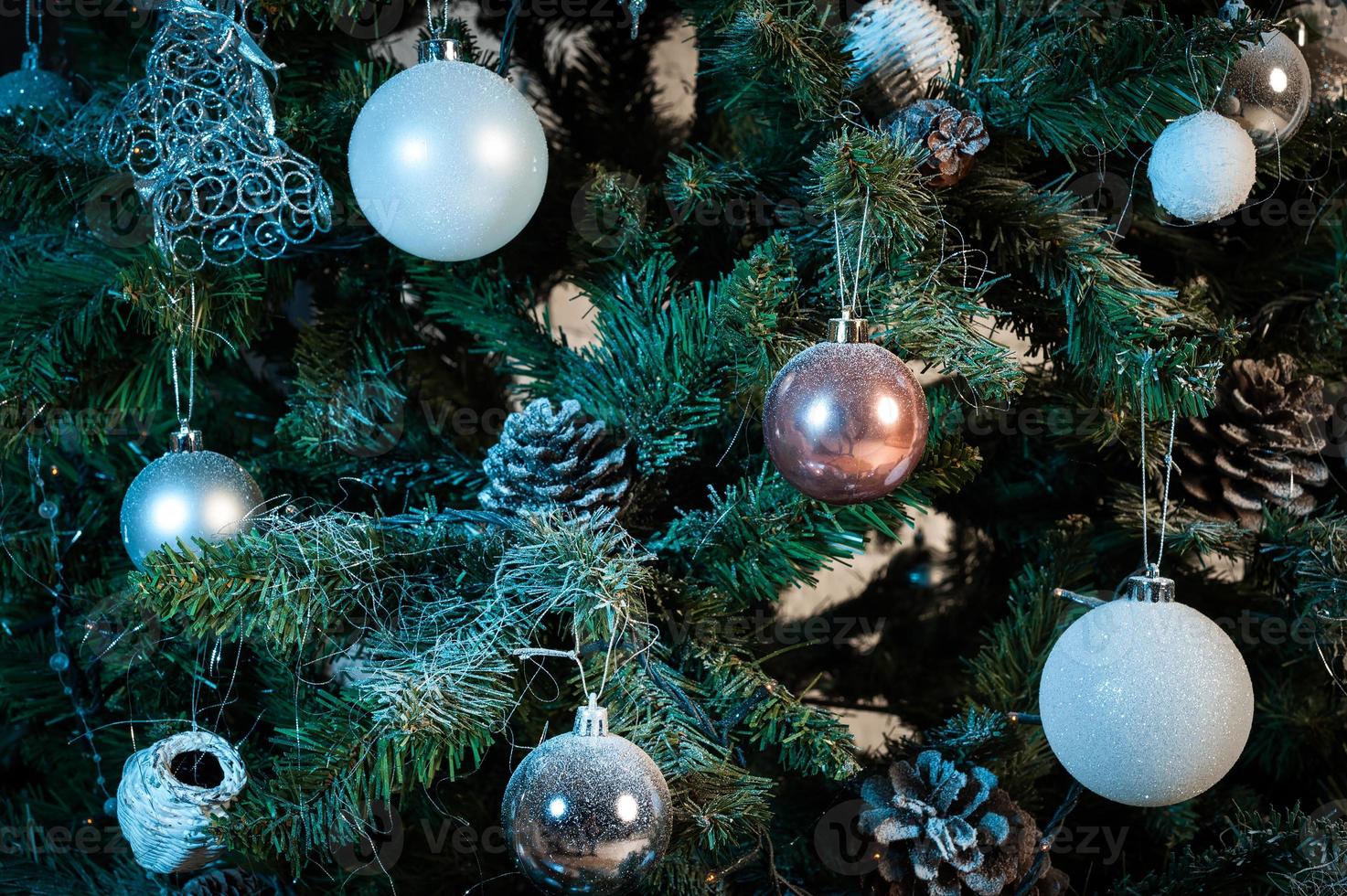 close up of christmas tree decorated with balls photo